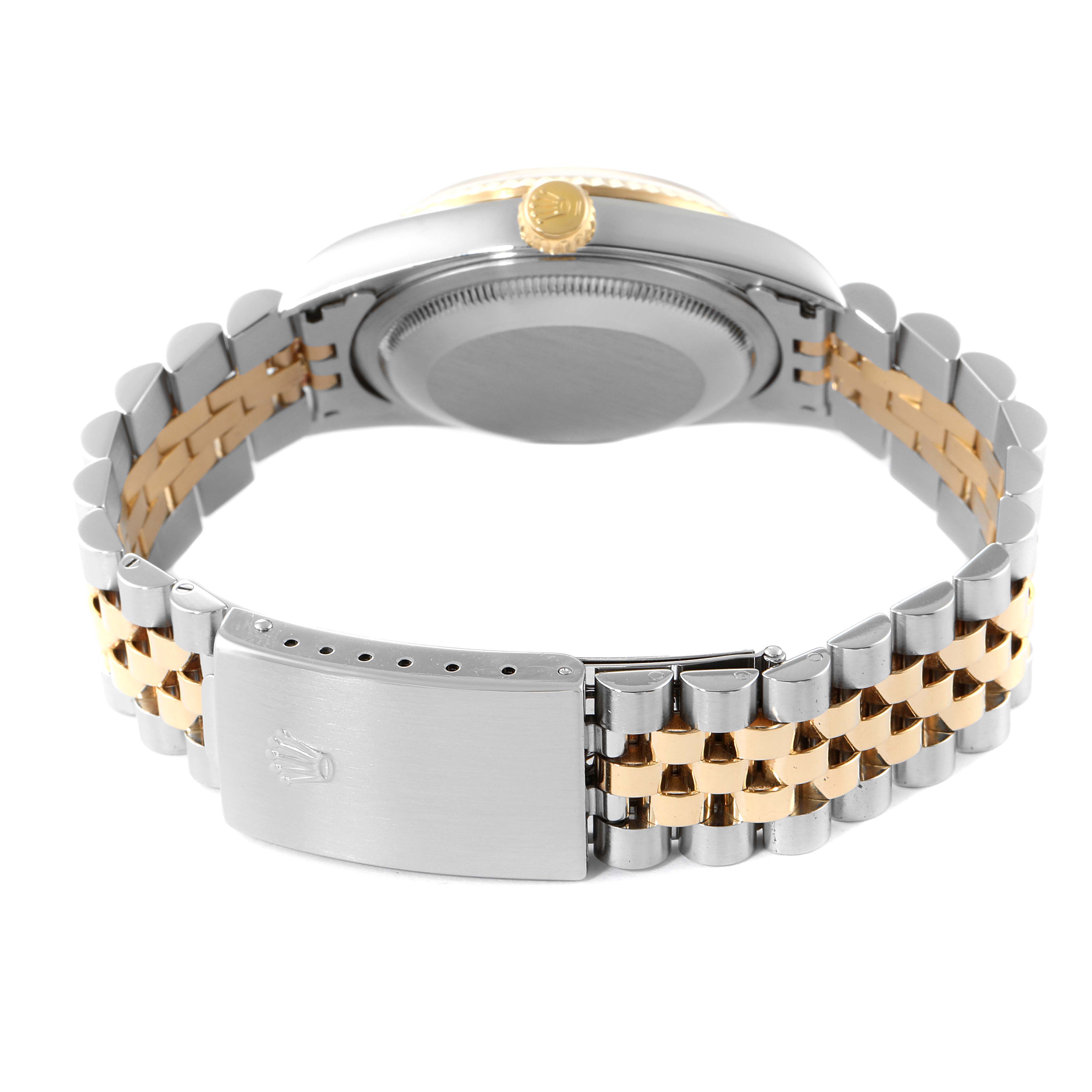 The image shows the back of a Rolex Datejust 16233 Men's Steel and Gold (two tone) Blue Dial 16233 Men's Steel and Gold (two tone) Blue Dial watch, highlighting its crown, caseback, and two-tone bracelet with a clasp.