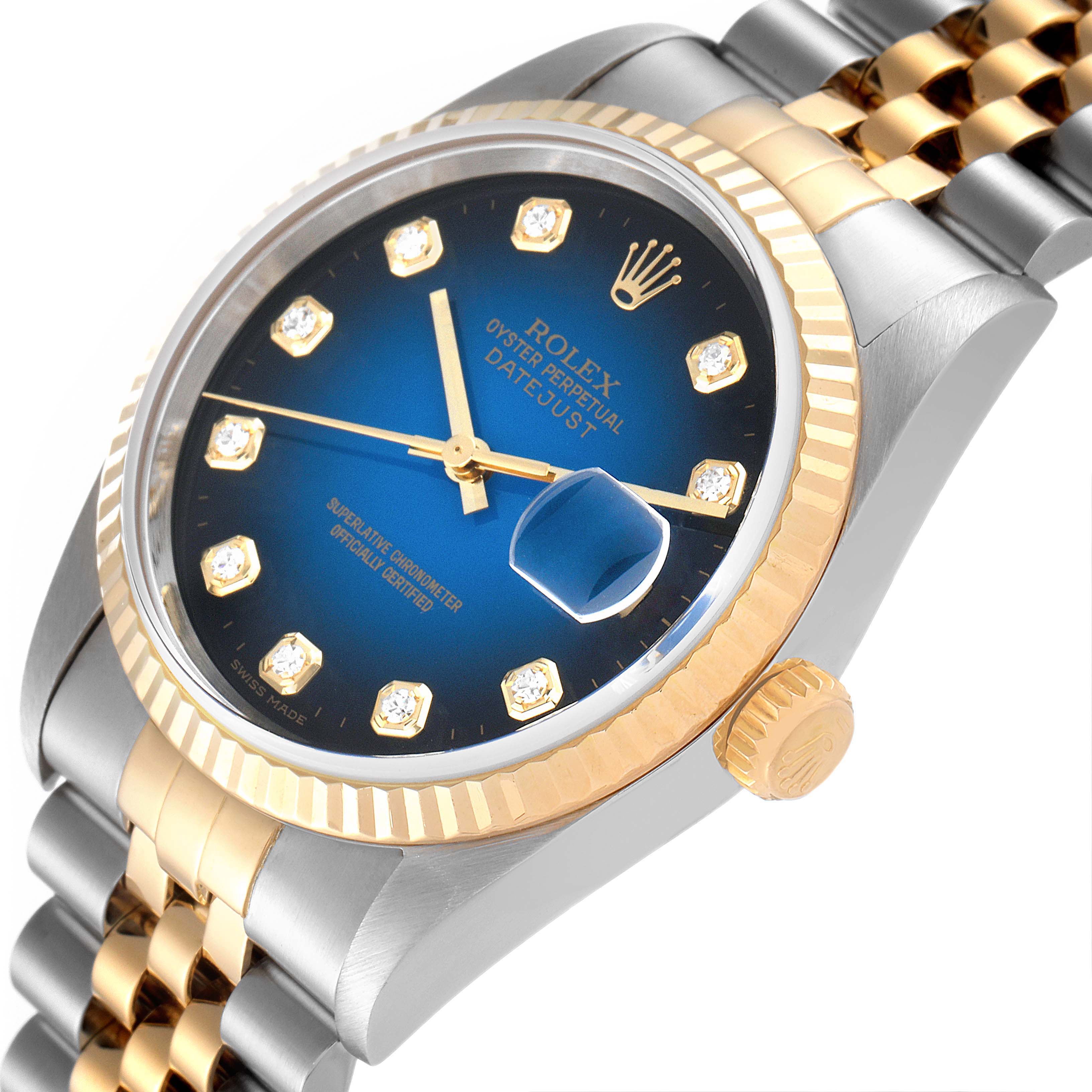 The image shows a close-up angled view of a Rolex Datejust 16233 Men's Steel and Gold (two tone) Blue Dial 16233 Men's Steel and Gold (two tone) Blue Dial, highlighting its dial, bezel, crown, and part of the bracelet.