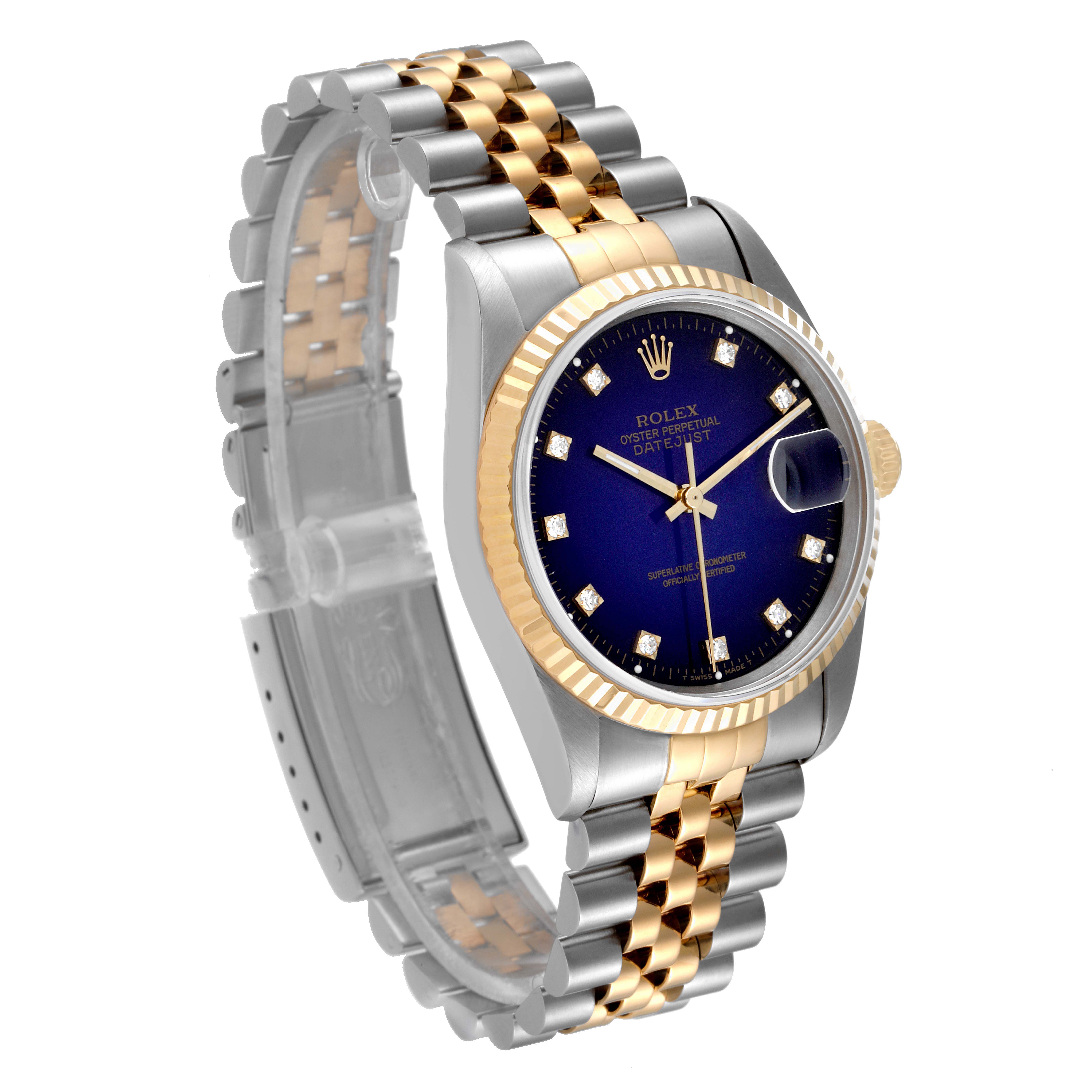 The image shows a Rolex Datejust 16233 Men's Steel and Gold (two tone) Blue Dial 16233 Men's Steel and Gold (two tone) Blue Dial watch at an angle highlighting its blue dial, fluted bezel, and two-tone jubilee bracelet.