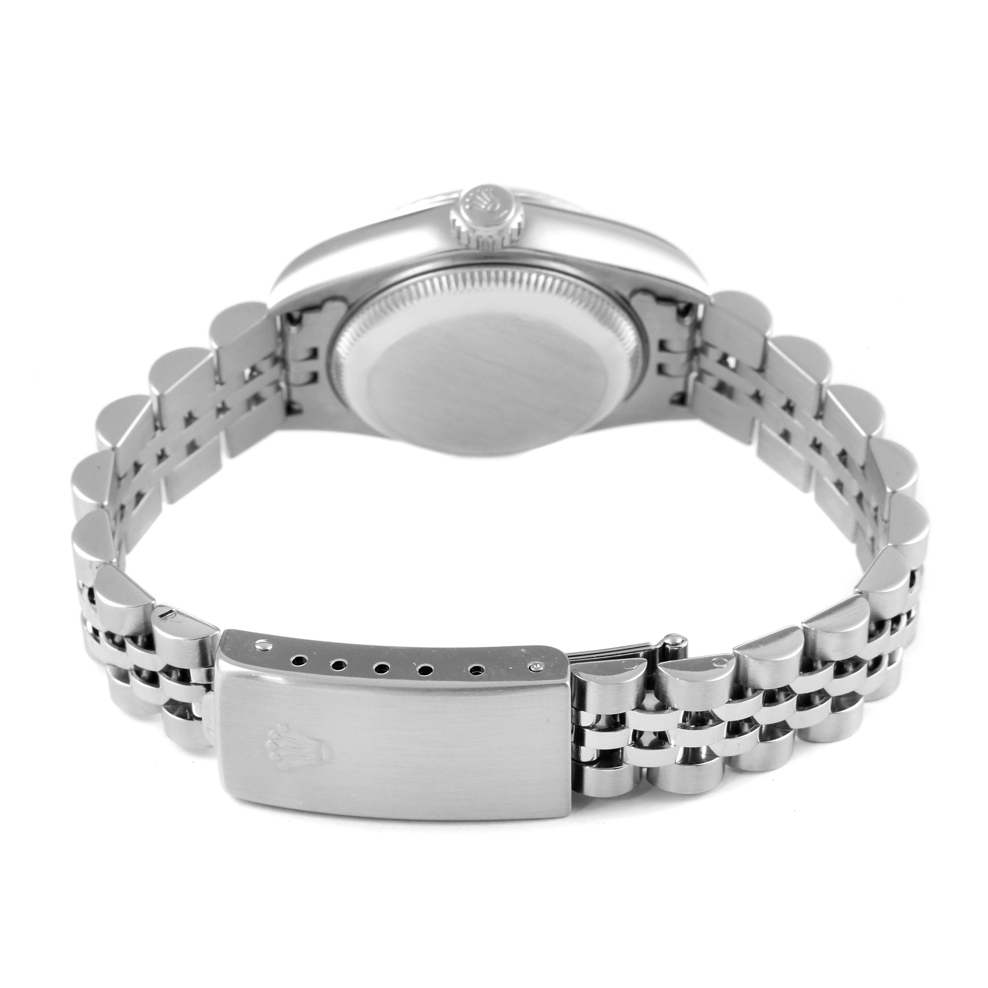 The image shows the backside and clasp of a Rolex Datejust 79174 Women's Stainless Steel Black Dial 79174 Women's Stainless Steel Black Dial watch, highlighting its metal bracelet and case back.