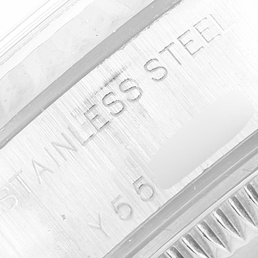 This image shows a close-up of the stainless steel engraving on the band or casing of a Rolex Datejust 79174 Women's Stainless Steel Black Dial 79174 Women's Stainless Steel Black Dial watch.