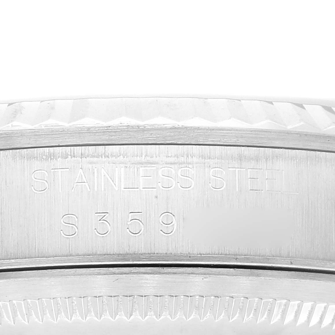 The image shows an extreme close-up of the side engraving on a stainless steel Rolex Datejust 16234 Men's Stainless Steel Blue Dial 16234 Men's Stainless Steel Blue Dial watch case.