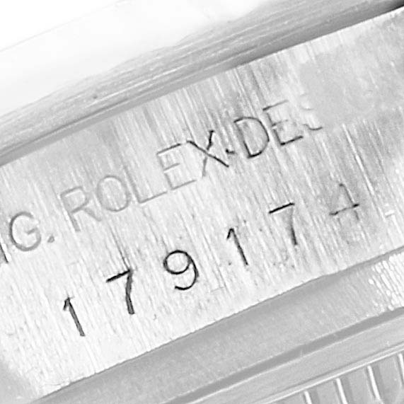 This image shows the serial number engraving on the side of a Rolex Datejust 179174 Women's Stainless Steel Mother of Pearl Dial 179174 Women's Stainless Steel Mother of Pearl Dial watch case.