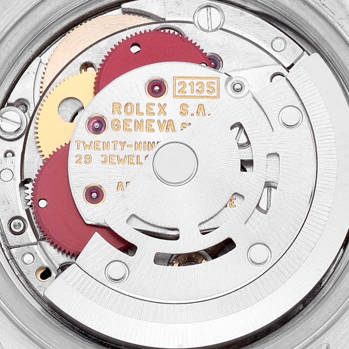 This is a close-up view of the internal mechanism of a Rolex Datejust 69173 Women's Steel and Gold (two tone) Champagne Dial 69173 Women's Steel and Gold (two tone) Champagne Dial watch, showcasing its gears, jewels, and rotor.