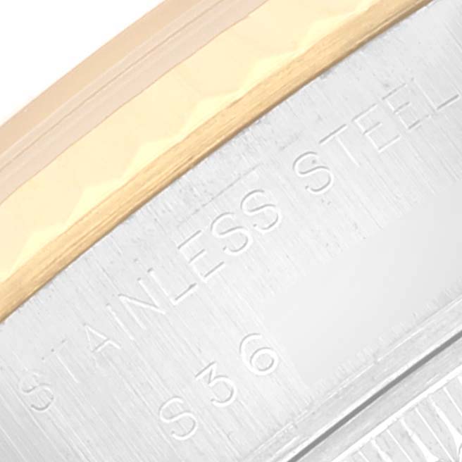 This image shows a close-up of the stainless steel part and the bezel of a Rolex Datejust 69173 Women's Steel and Gold (two tone) Champagne Dial 69173 Women's Steel and Gold (two tone) Champagne Dial watch.