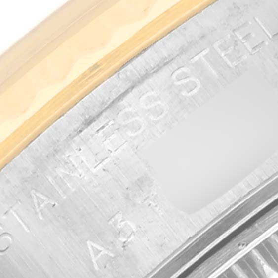 The image shows a close-up of the stainless steel and gold bezel of a Rolex Datejust 79173 Women's Steel and Gold (two tone) White Dial 79173 Women's Steel and Gold (two tone) White Dial watch.