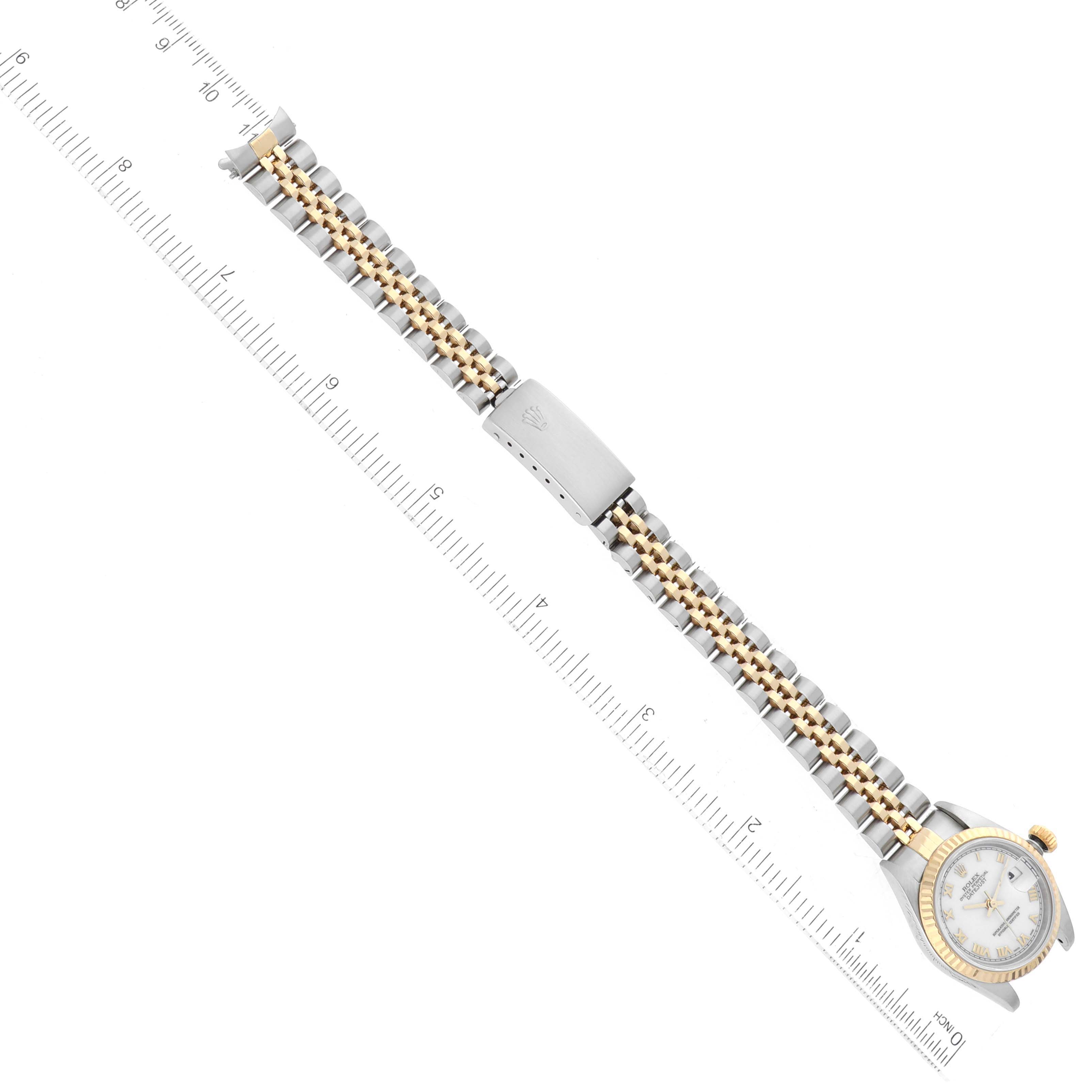 The image shows a top-down view of a Rolex Datejust 79173 Women's Steel and Gold (two tone) White Dial 79173 Women's Steel and Gold (two tone) White Dial watch, highlighting its bracelet, clasp, and watch face.
