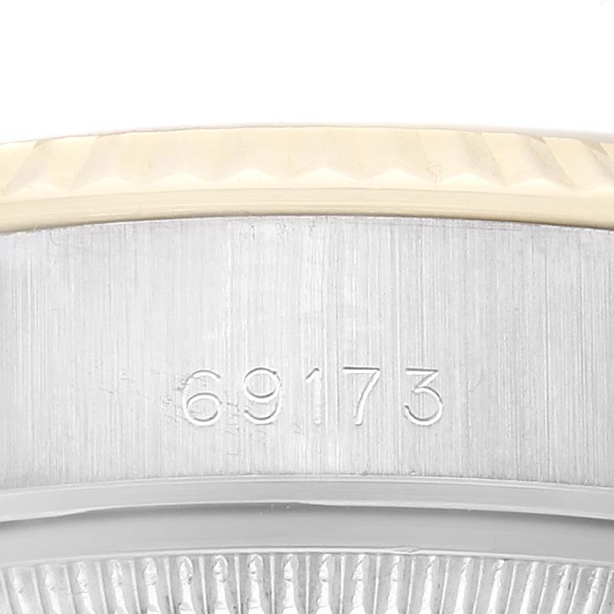 This image shows a close-up side view of the case side of the Rolex Datejust 69173 Women's Steel and Gold (two tone) White Dial 69173 Women's Steel and Gold (two tone) White Dial model, revealing the engraved model number "69173."