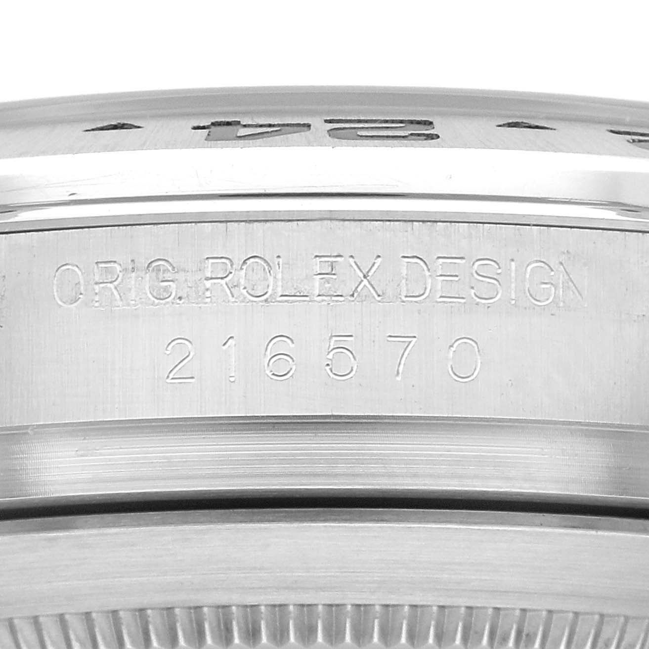 This image shows a close-up of the case side of a Rolex Explorer 216570 Men's Stainless Steel White Dial 216570 Men's Stainless Steel White Dial watch, displaying the engraved serial number.