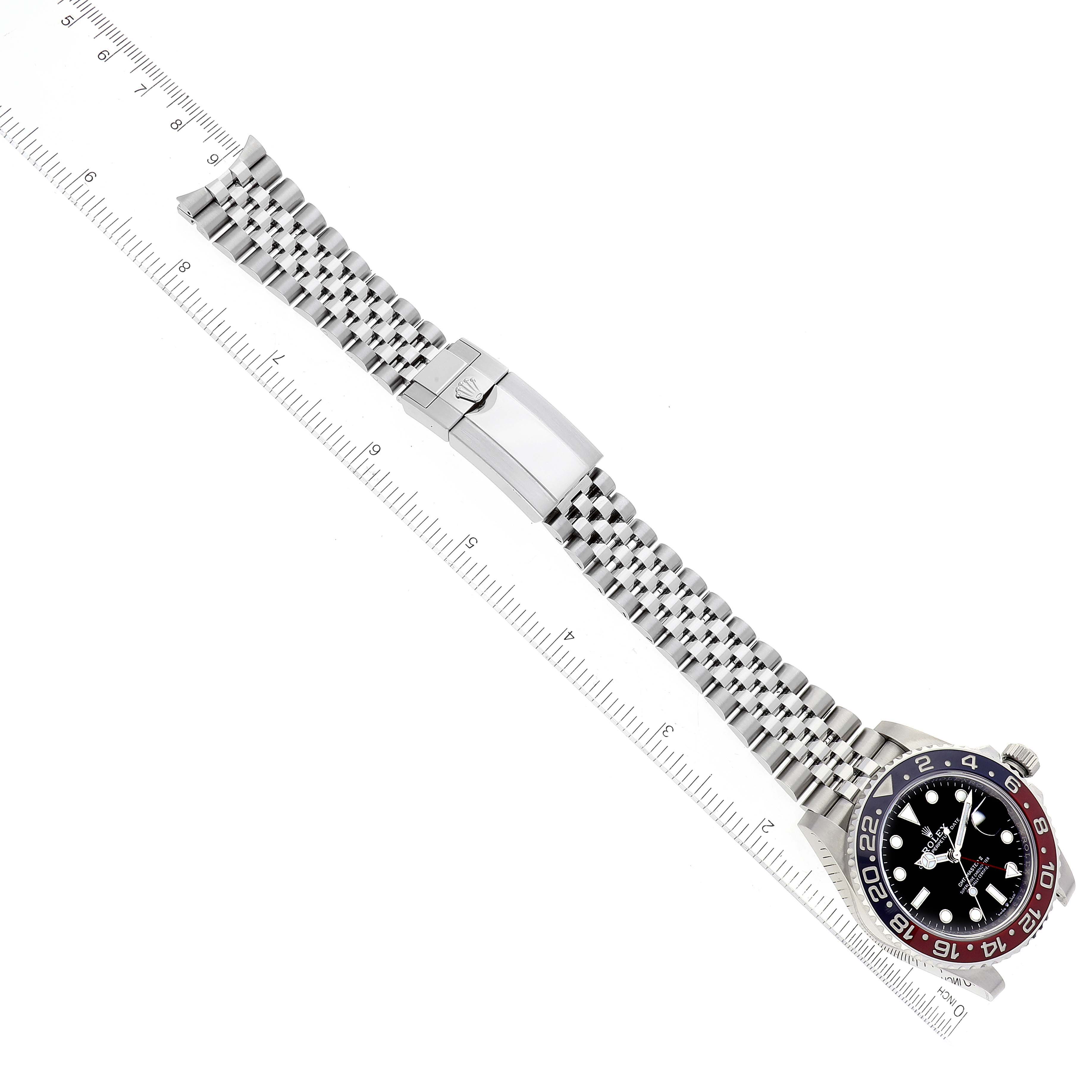 The image shows a Rolex GMT-Master 126710BLRO Men
s Stainless Steel Black Dial 126710BLRO Men
s Stainless Steel Black Dial watch lying flat, displaying its face, bezel, and metal bracelet band.