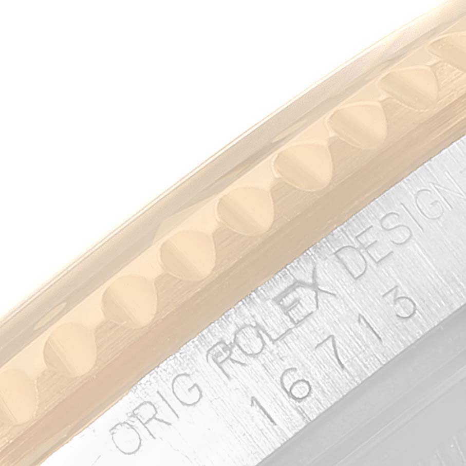 This image shows the case side of a Rolex GMT-Master 16713 Men's Steel and Gold (two tone) Black Dial 16713 Men's Steel and Gold (two tone) Black Dial watch, highlighting the model number 16713 engraved on the case.