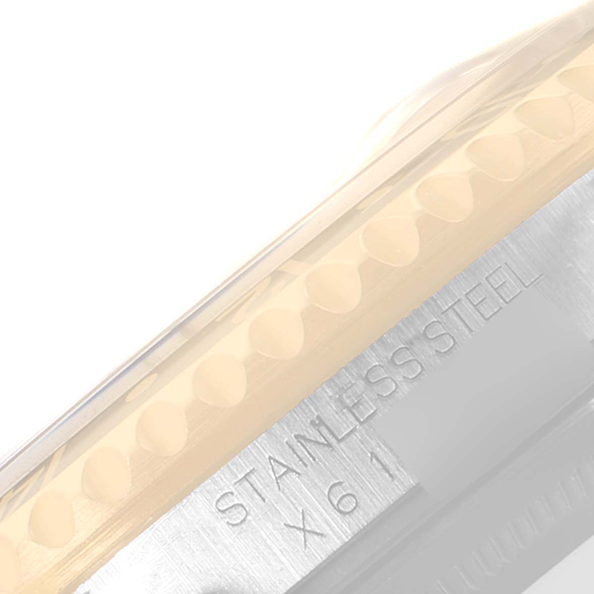 This image shows the side view of the stainless steel case and part of the bezel of a Rolex GMT-Master 16713 Men's Steel and Gold (two tone) Black Dial 16713 Men's Steel and Gold (two tone) Black Dial watch.