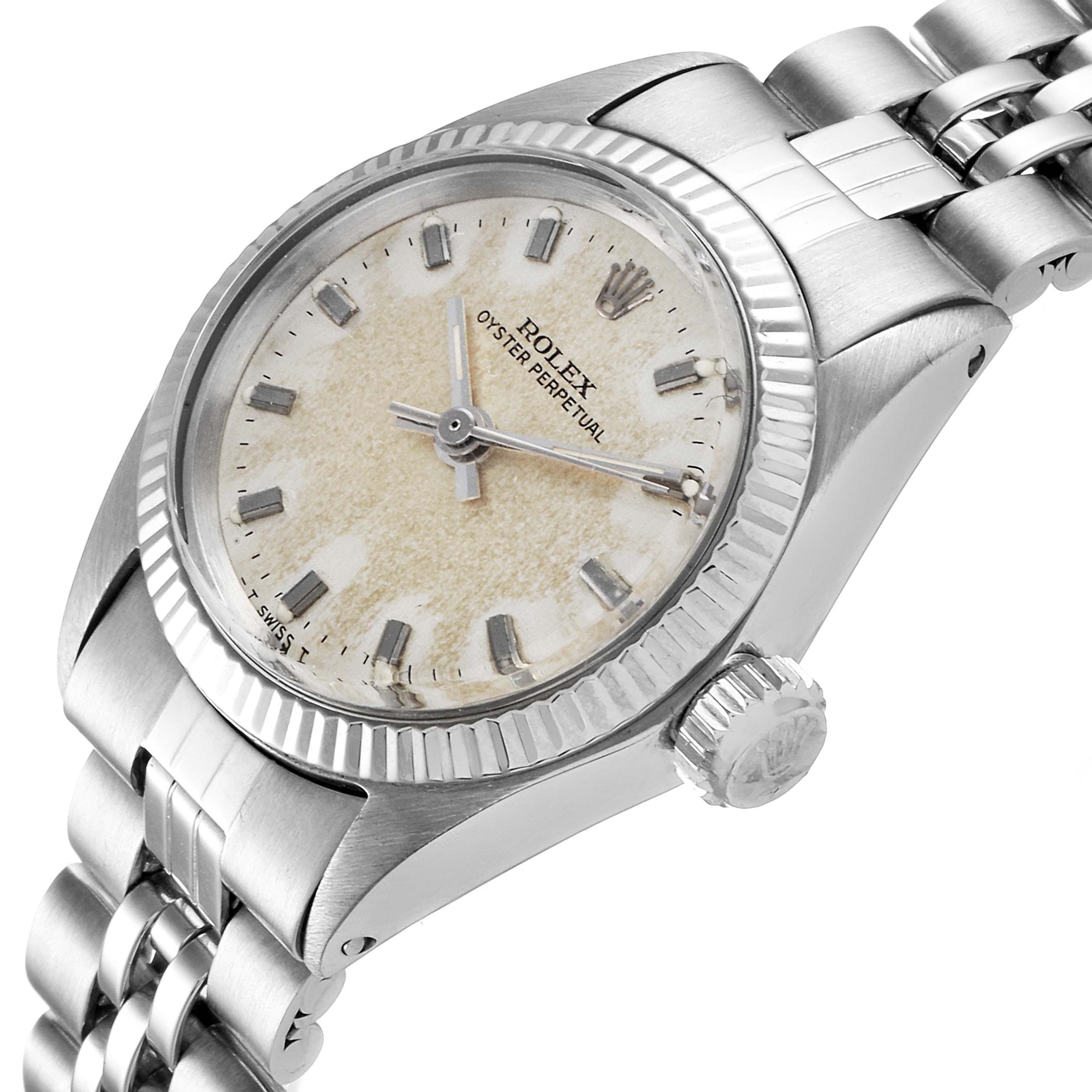 This image shows a Rolex Oyster Perpetual 6619 Women's Stainless Steel Silver Dial 6619 Women's Stainless Steel Silver Dial watch from an angled side view, highlighting its face, bezel, crown, and bracelet.