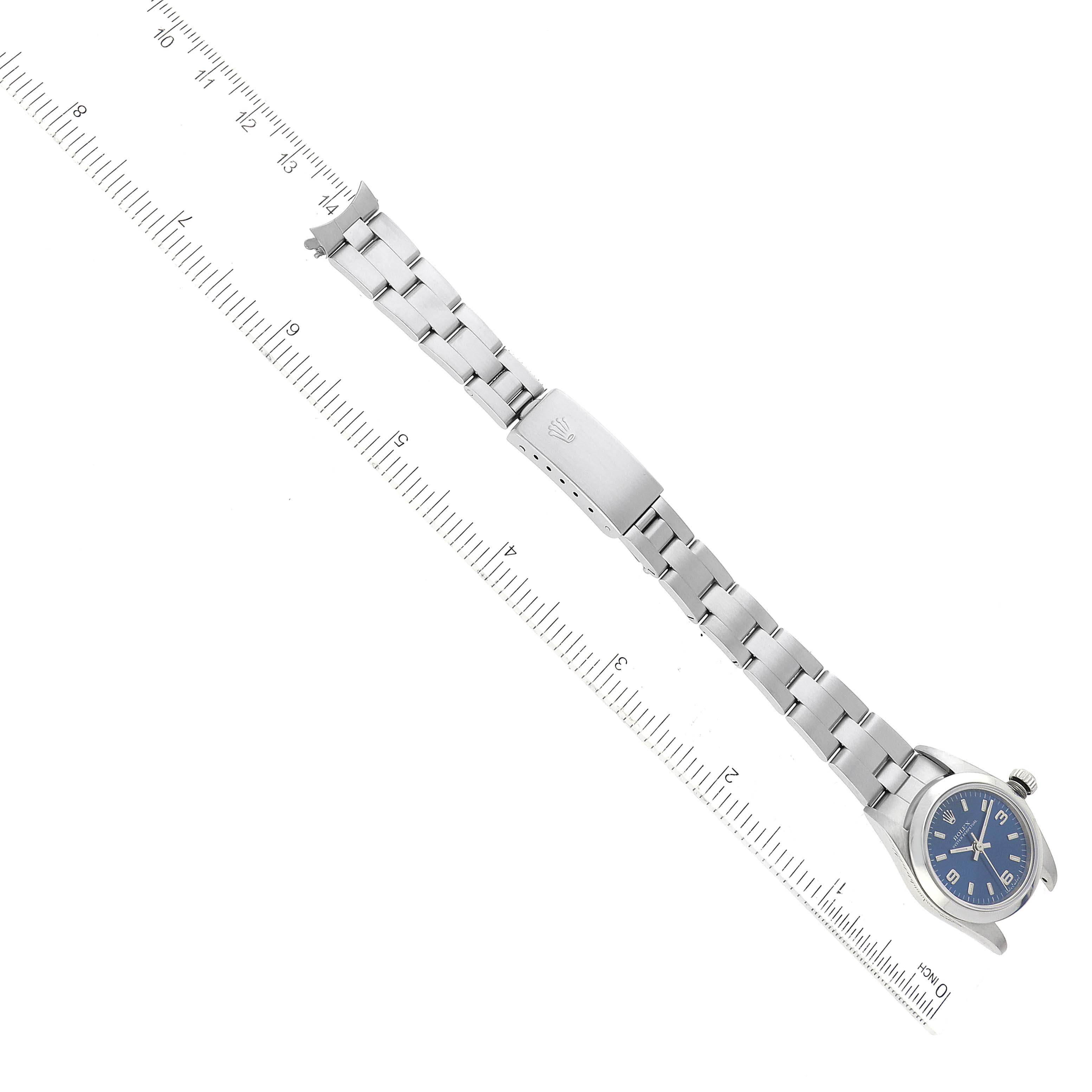 The image shows a Rolex Oyster Perpetual 76080 Women's Stainless Steel Blue Dial 76080 Women's Stainless Steel Blue Dial watch from a top-down angle, highlighting the blue dial, bracelet, and clasp.