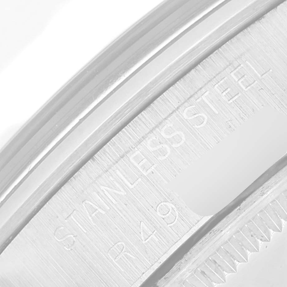 This is a close-up shot of the case back edge of the Rolex Vintage Collection 1002 Men's Stainless Steel Silver Dial 1002 Men's Stainless Steel Silver Dial model, showing "STAINLESS STEEL" engraving.