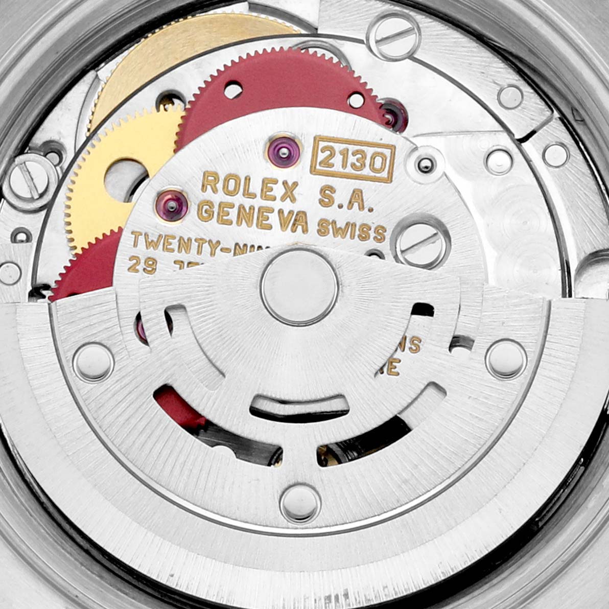 The image shows a close-up of the movement and inner mechanical parts of a Rolex Oyster Perpetual 67183 Women's Steel and Gold (two tone) Blue Dial 67183 Women's Steel and Gold (two tone) Blue Dial watch.