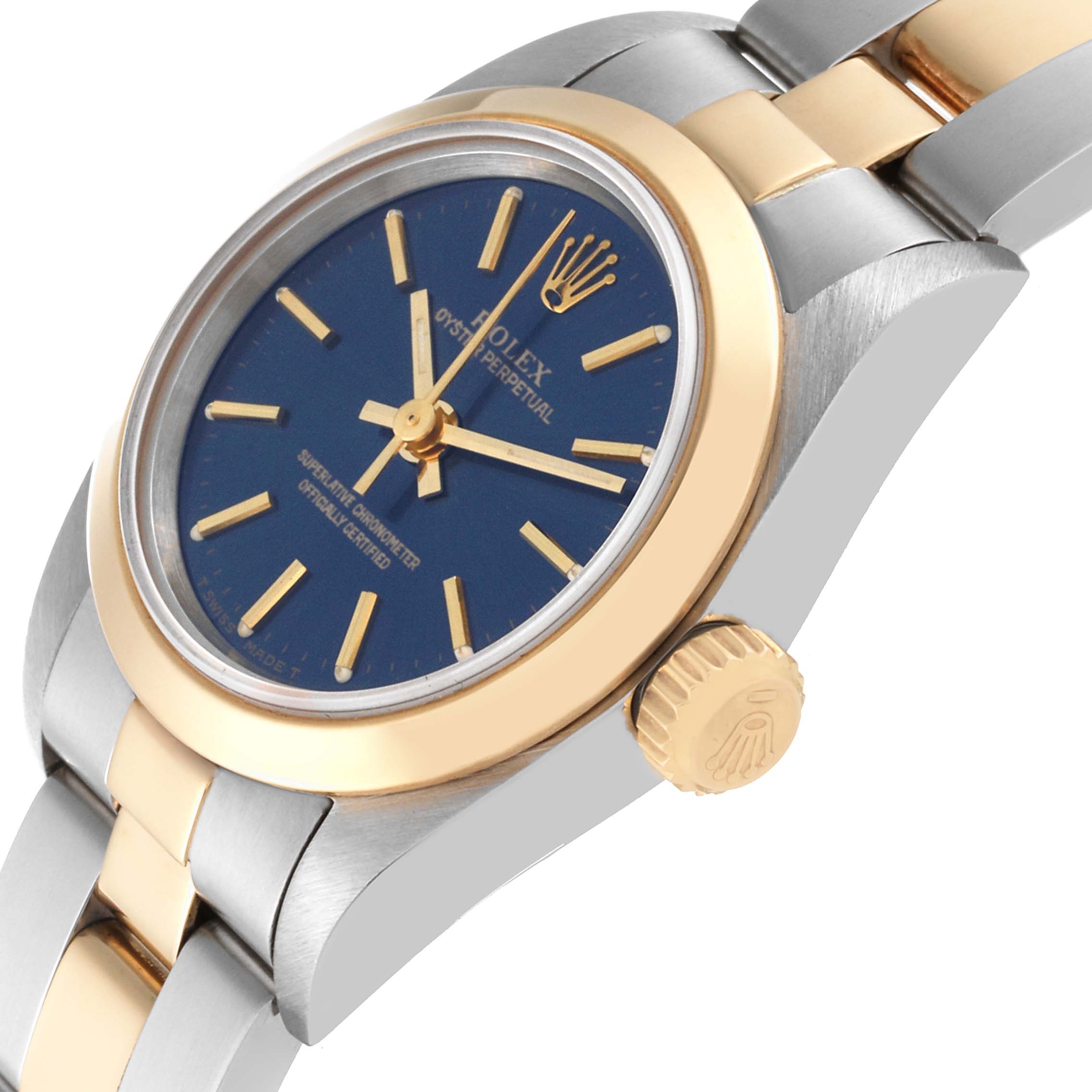 The image displays a side angle of a Rolex Oyster Perpetual 67183 Women's Steel and Gold (two tone) Blue Dial 67183 Women's Steel and Gold (two tone) Blue Dial watch, highlighting the crown, bezel, dial, and part of the bracelet.