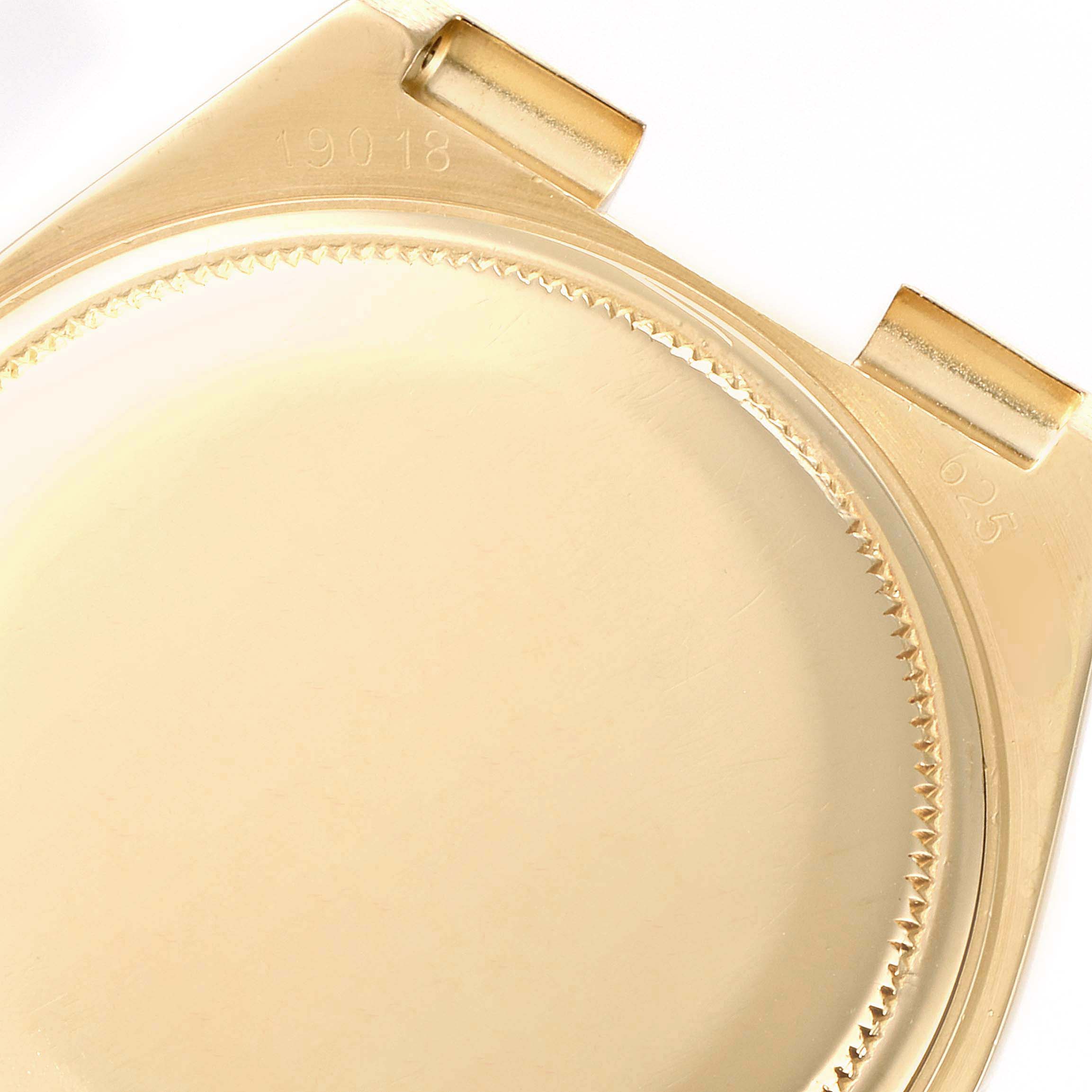 This image shows the underside of a gold Rolex Oysterquartz 19018 Men's Yellow Gold Silver Dial 19018 Men's Yellow Gold Silver Dial case, featuring the model number 19018.