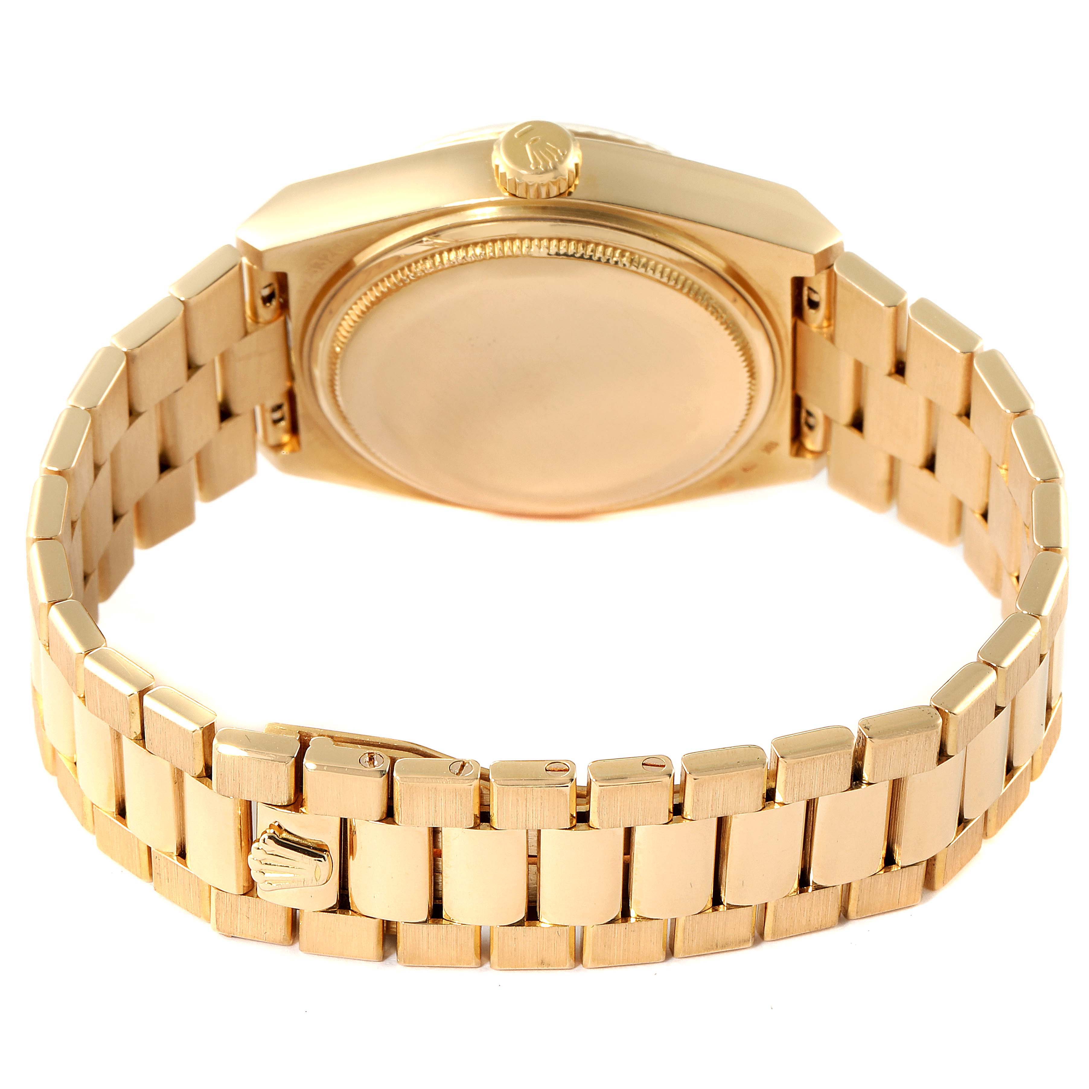 The Rolex Oysterquartz 19018 Men's Yellow Gold Silver Dial 19018 Men's Yellow Gold Silver Dial watch is shown from the back, highlighting the bracelet and case back.