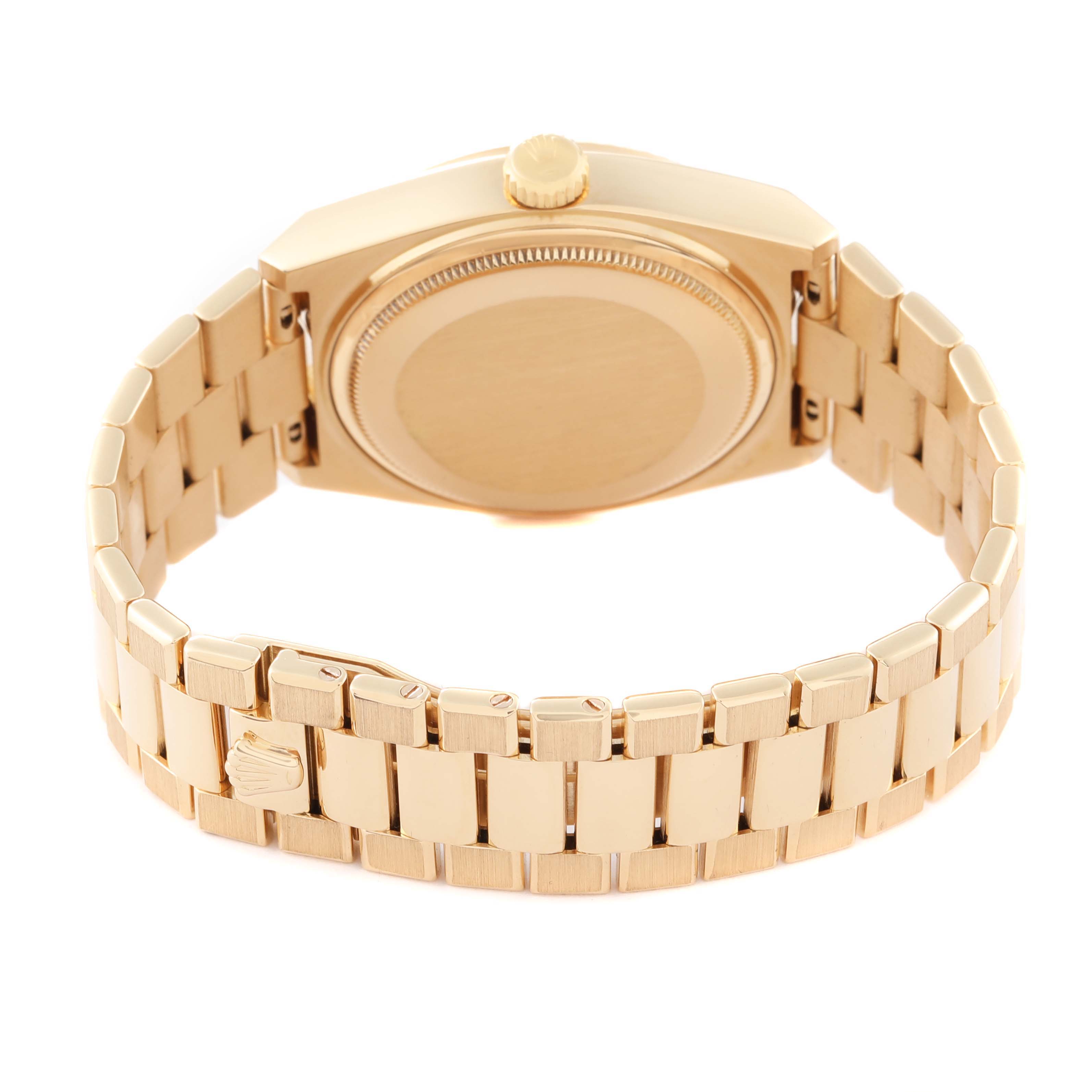 The image shows the back side of a Rolex President 19018 Men
s Yellow Gold Champagne Dial 19018 Men
s Yellow Gold Champagne Dial model watch, featuring its bracelet and case back.
