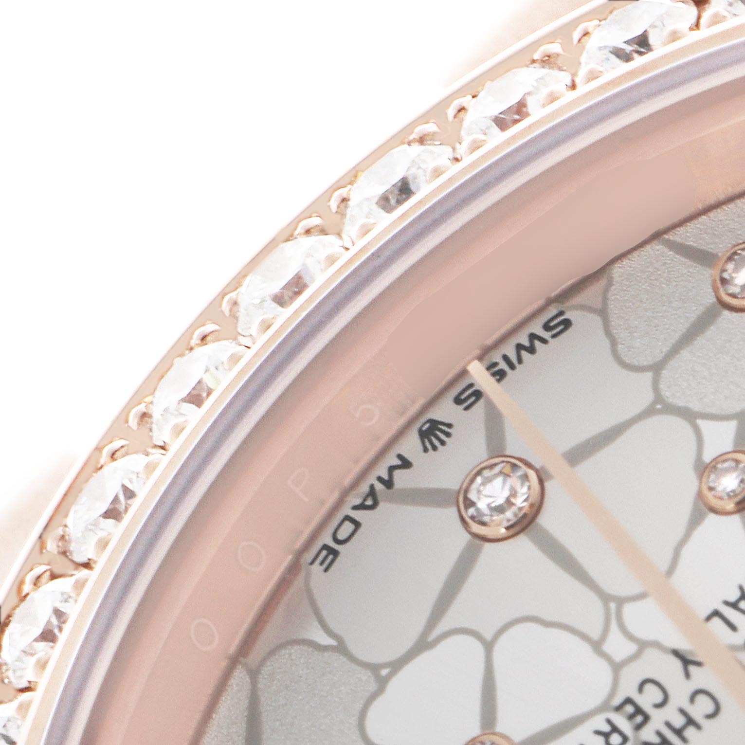 This close-up angle of the Rolex Datejust shows the bejeweled bezel and part of the patterned dial with diamond markers.