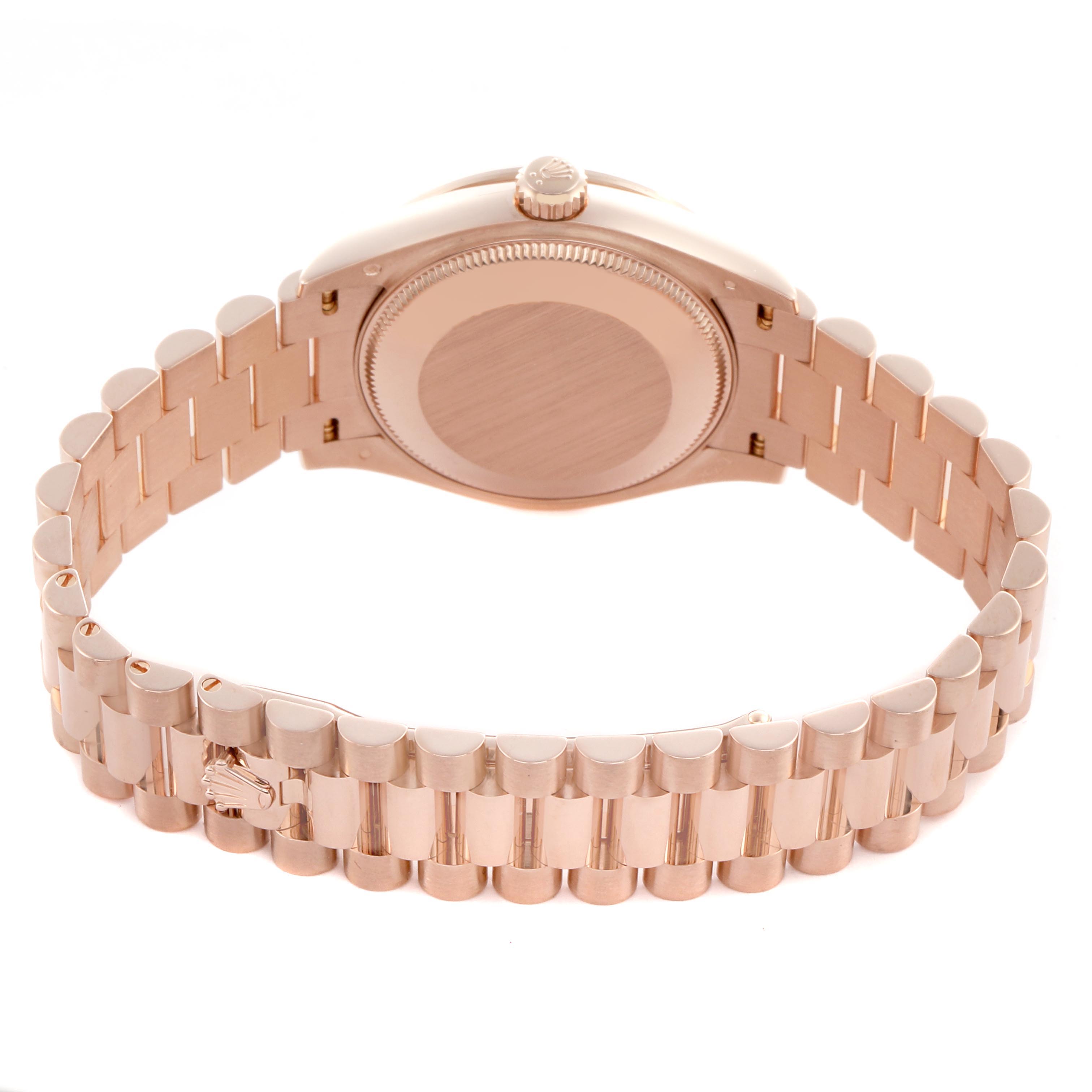 The image shows the back of a Rolex Datejust watch, highlighting the case back and bracelet clasp.