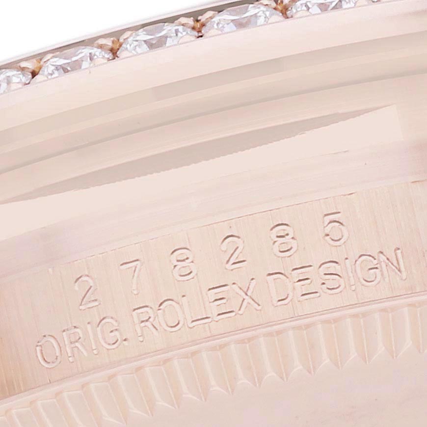 This image shows the engraved side view of a Rolex Datejust bezel, featuring part of the serial number and a diamond setting.