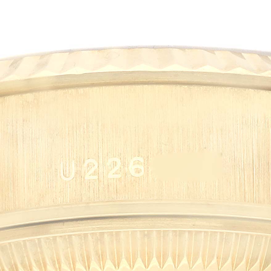 This close-up image shows the serial number engraving on the side of a Rolex President 79178 Women
s Yellow Gold Champagne Dial 79178 Women
s Yellow Gold Champagne Dial model.
