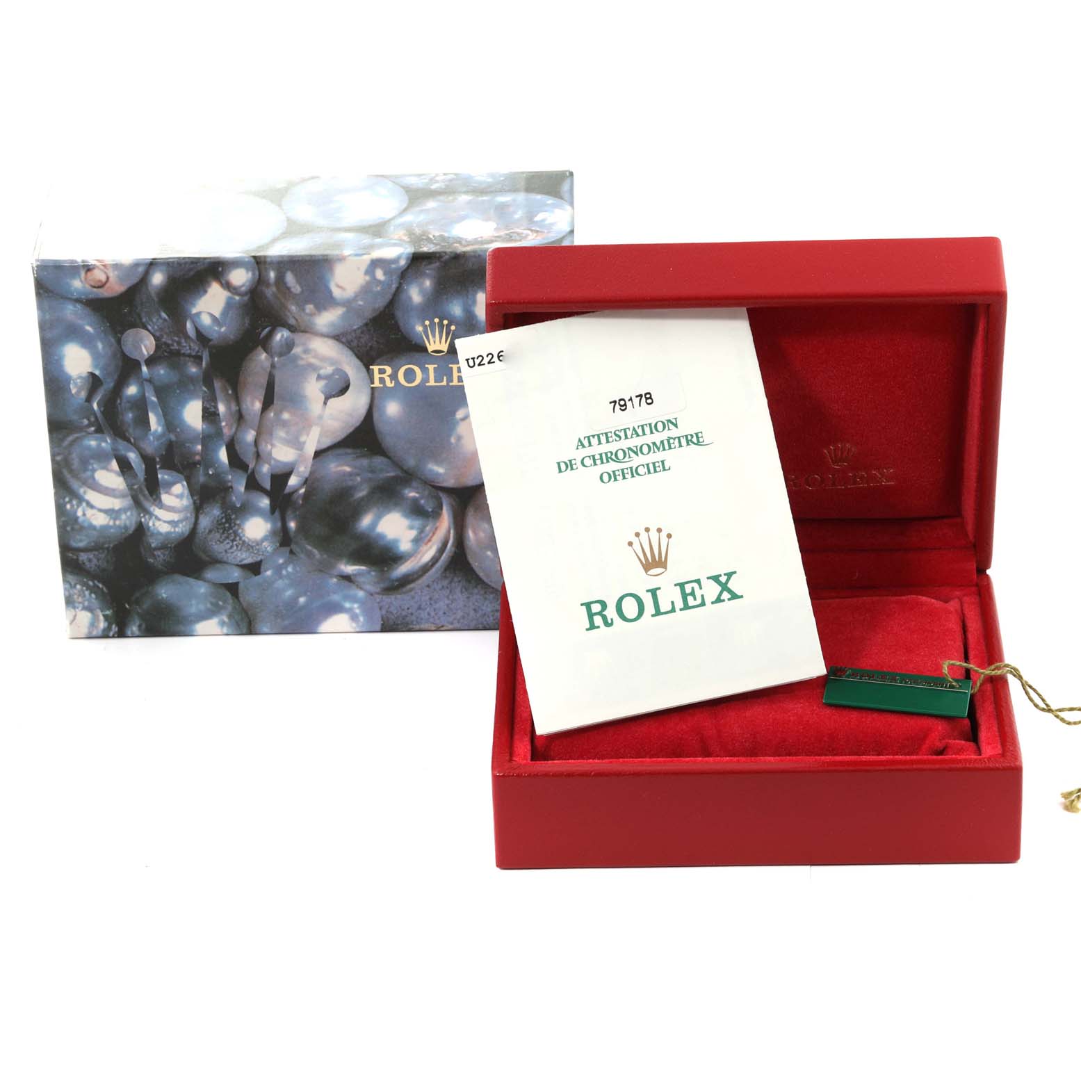 The image shows a Rolex President 79178 Women
s Yellow Gold Champagne Dial 79178 Women
s Yellow Gold Champagne Dial model watch box, documentation, and tag angled from the front.