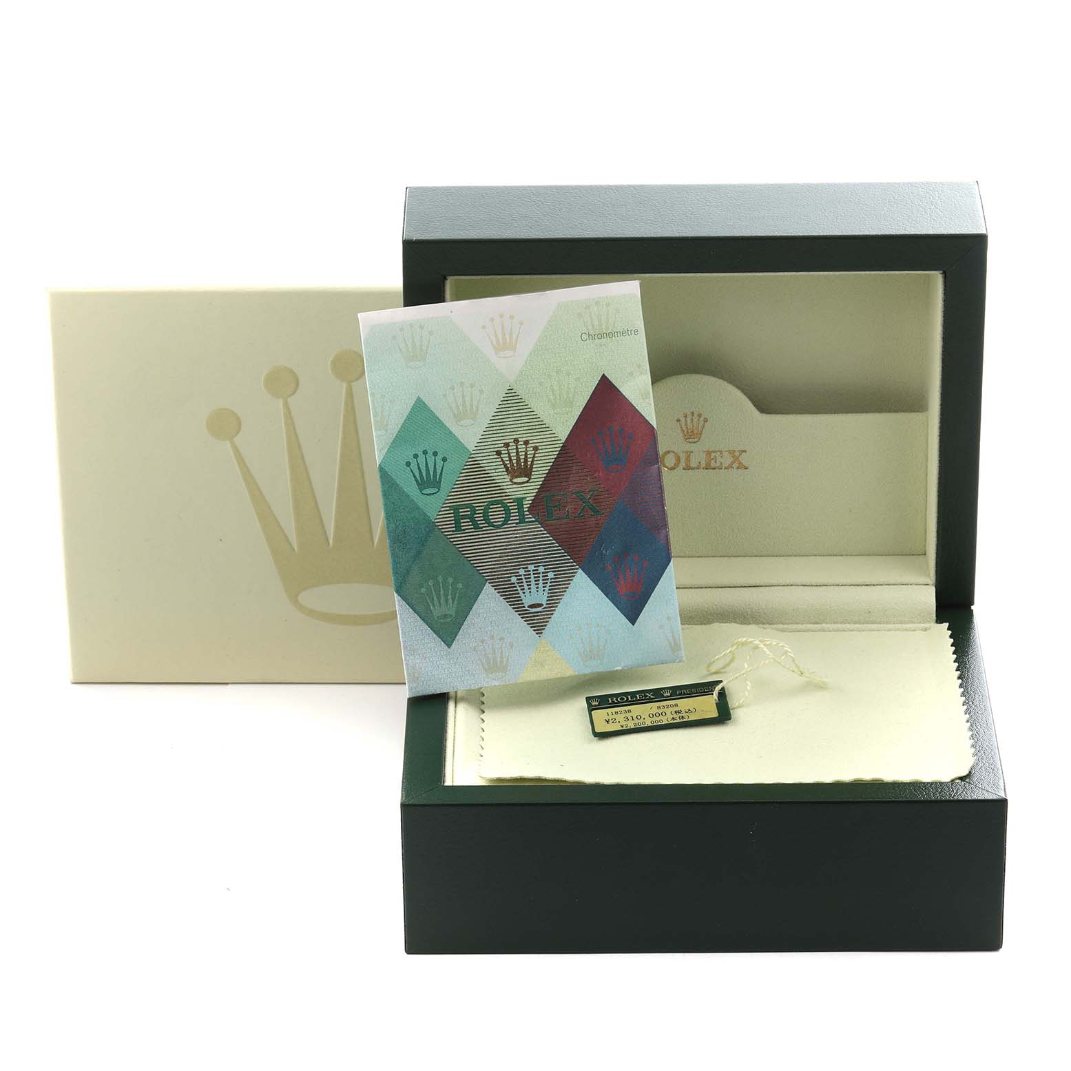 The image shows a Rolex President 118238 Men
s Yellow Gold Champagne Dial 118238 Men
s Yellow Gold Champagne Dial box with a booklet, cushion, and tag, viewed from the front.