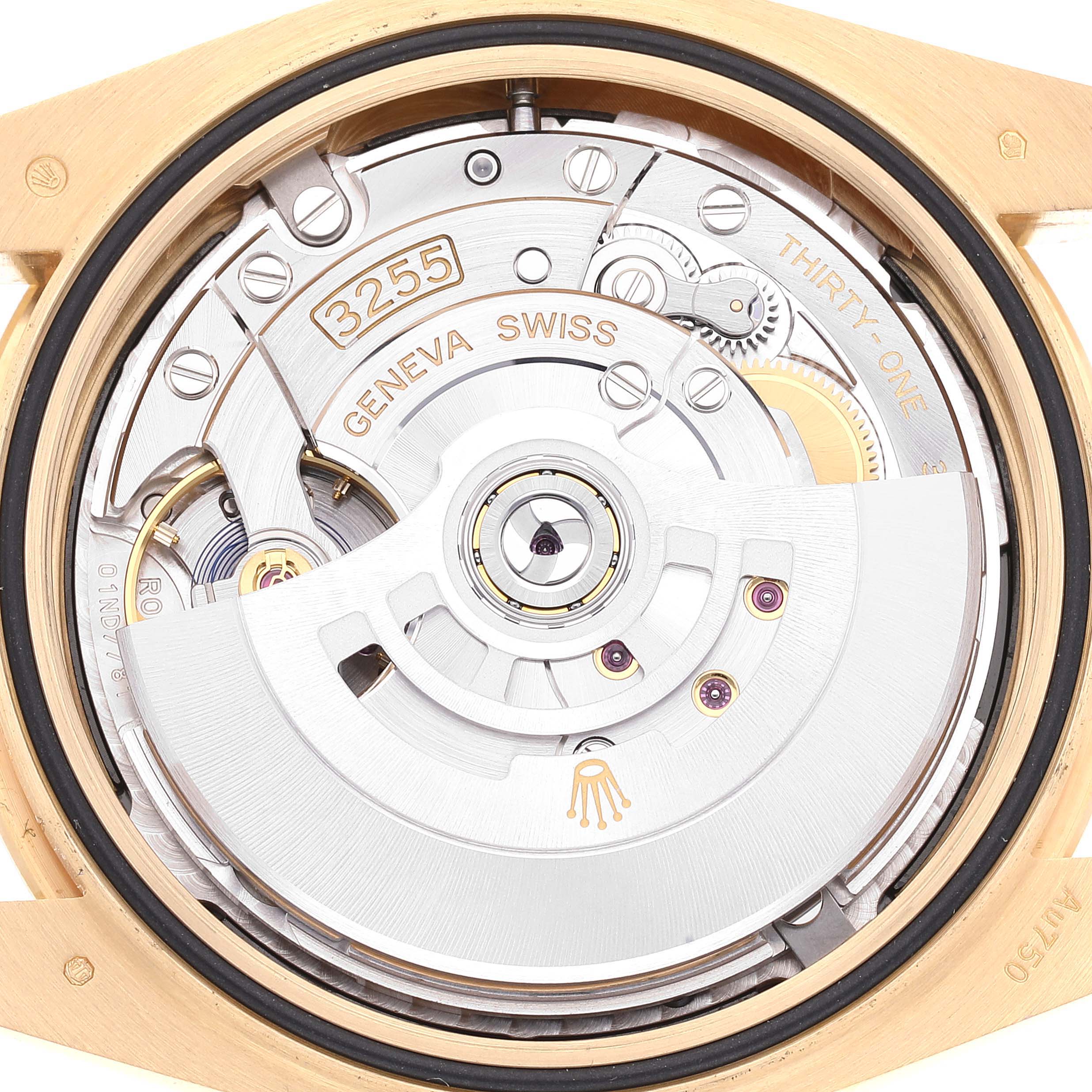 This is a close-up view of the back of a Rolex President 228238 Men's Yellow Gold Black Dial 228238 Men's Yellow Gold Black Dial model watch showing its intricate mechanical movement.