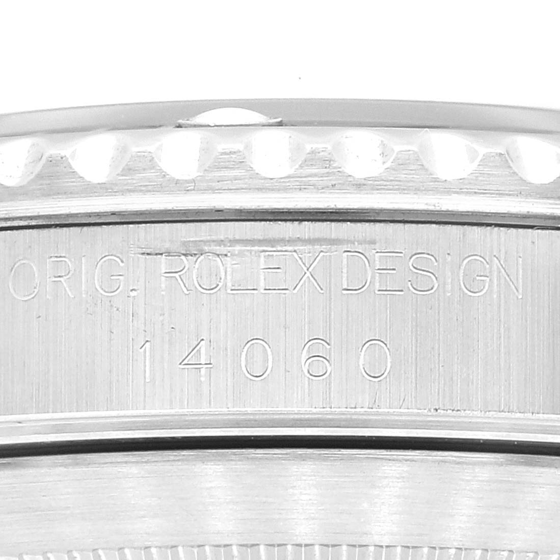 This image shows a close-up of the case back with the engraving "ORIG. ROLEX DESIGN 14060" on a Rolex Submariner 14060 Men
s Stainless Steel Black Dial 14060 Men
s Stainless Steel Black Dial.