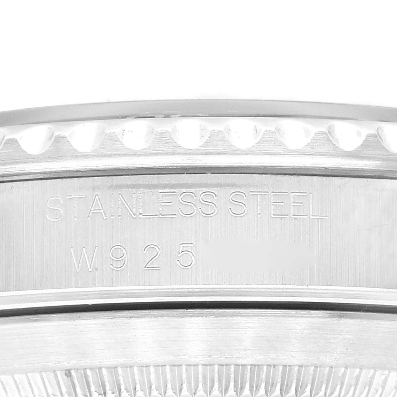 The image shows an angled close-up of the stainless steel case back with engravings of a Rolex Submariner 14060 Men
s Stainless Steel Black Dial 14060 Men
s Stainless Steel Black Dial watch.