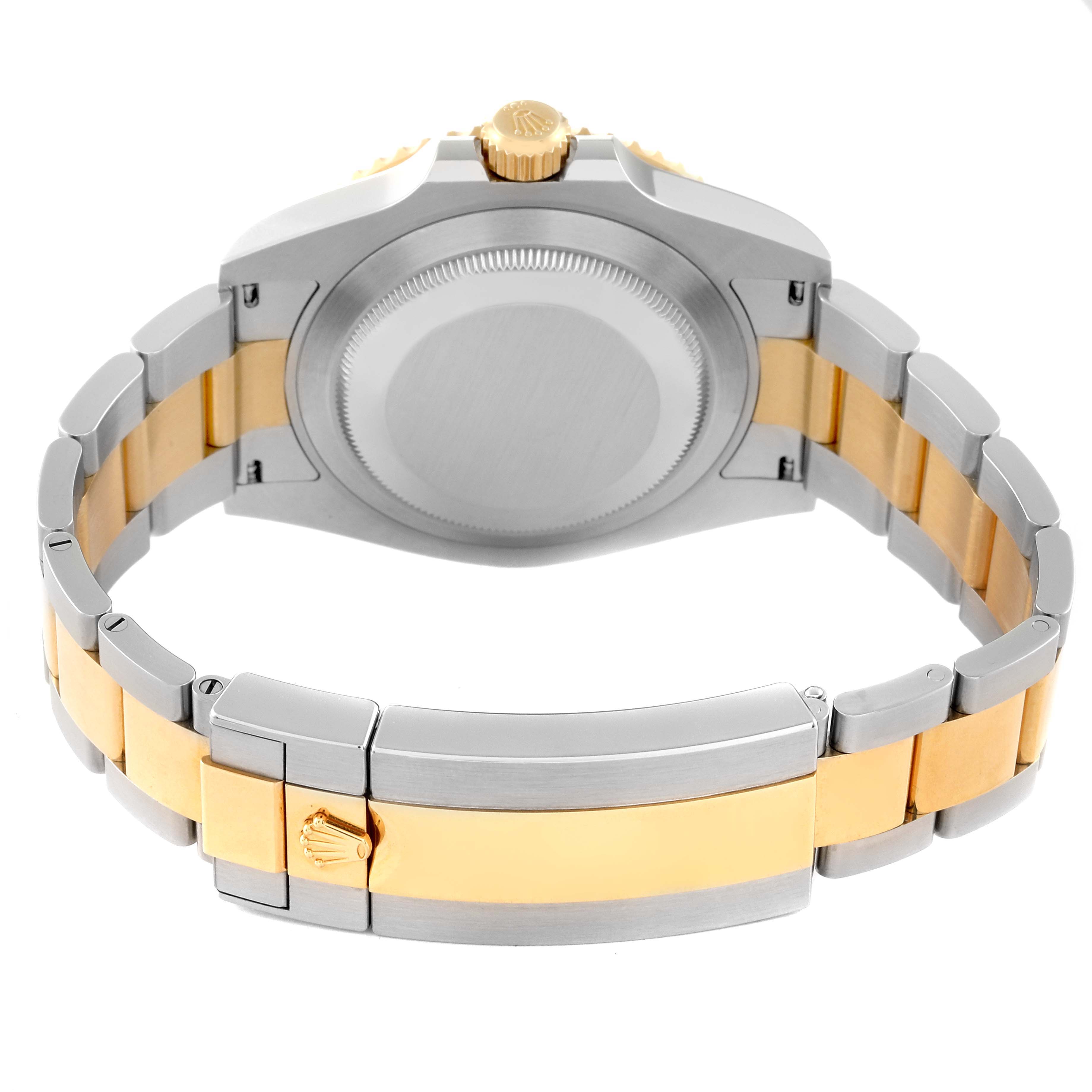 The image shows the back case, crown, and bracelet of a Rolex Submariner 126613 Men's Steel and Gold (two tone) Blue Dial 126613 Men's Steel and Gold (two tone) Blue Dial watch from a rear angle.