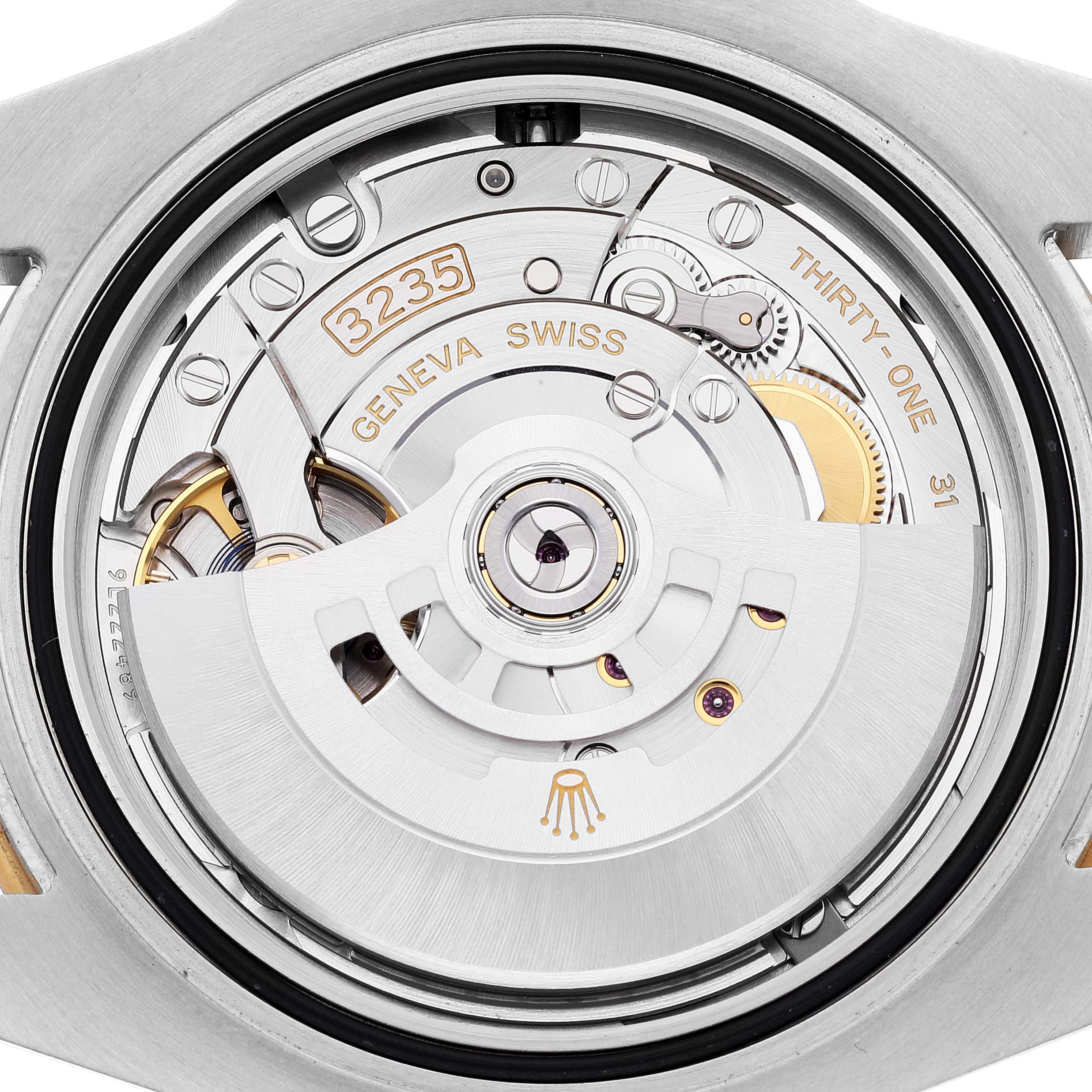 This image shows the intricate movement and internal mechanism of a Rolex Submariner 126613 Men's Steel and Gold (two tone) Blue Dial 126613 Men's Steel and Gold (two tone) Blue Dial watch, viewed from the back.