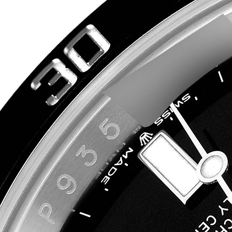 This image shows a close-up of the Rolex Submariner 126610 Men
s Stainless Steel Black Dial 126610 Men
s Stainless Steel Black Dial model
s bezel, dial, and minute hand at an angled view.