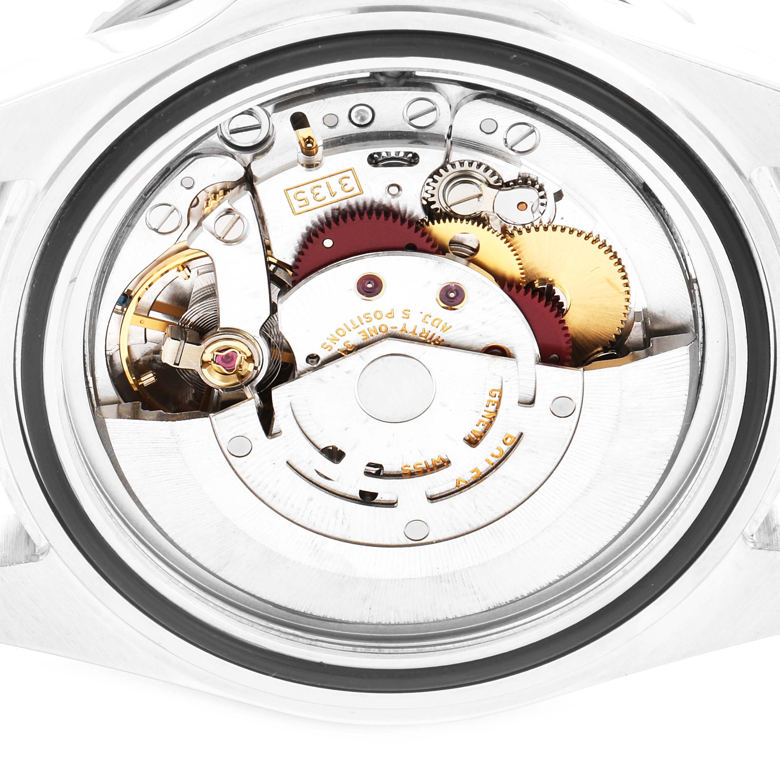 This image shows the back view of a Rolex Submariner 16610 Men
s Stainless Steel Black Dial 16610 Men
s Stainless Steel Black Dial revealing its intricate movement and internal components.