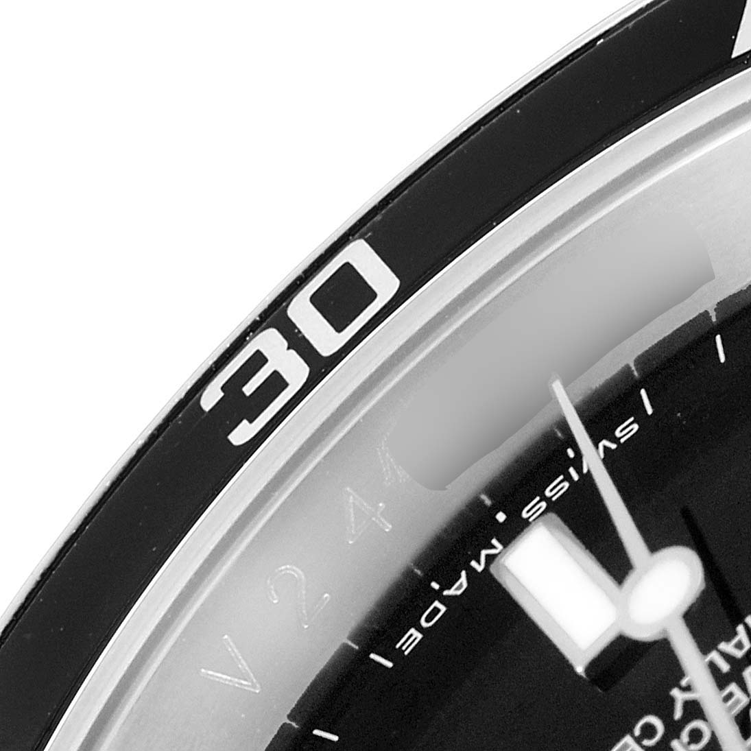 The image shows a close-up of the Rolex Submariner 16610 Men
s Stainless Steel Black Dial 16610 Men
s Stainless Steel Black Dial watch
s bezel and part of the dial, focusing on the 30-minute mark.