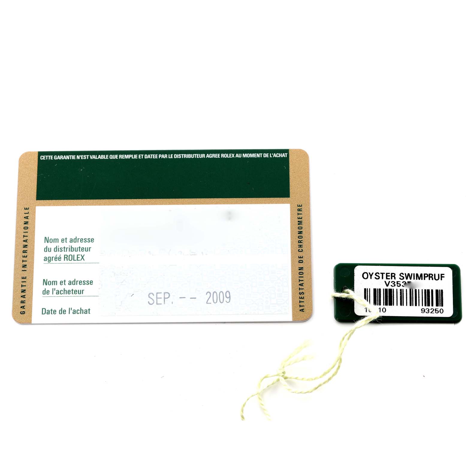 The image shows the guarantee card and an Oyster Swimpruf tag with the model information for a Rolex Submariner 16610 Men's Stainless Steel Black Dial 16610 Men's Stainless Steel Black Dial watch.