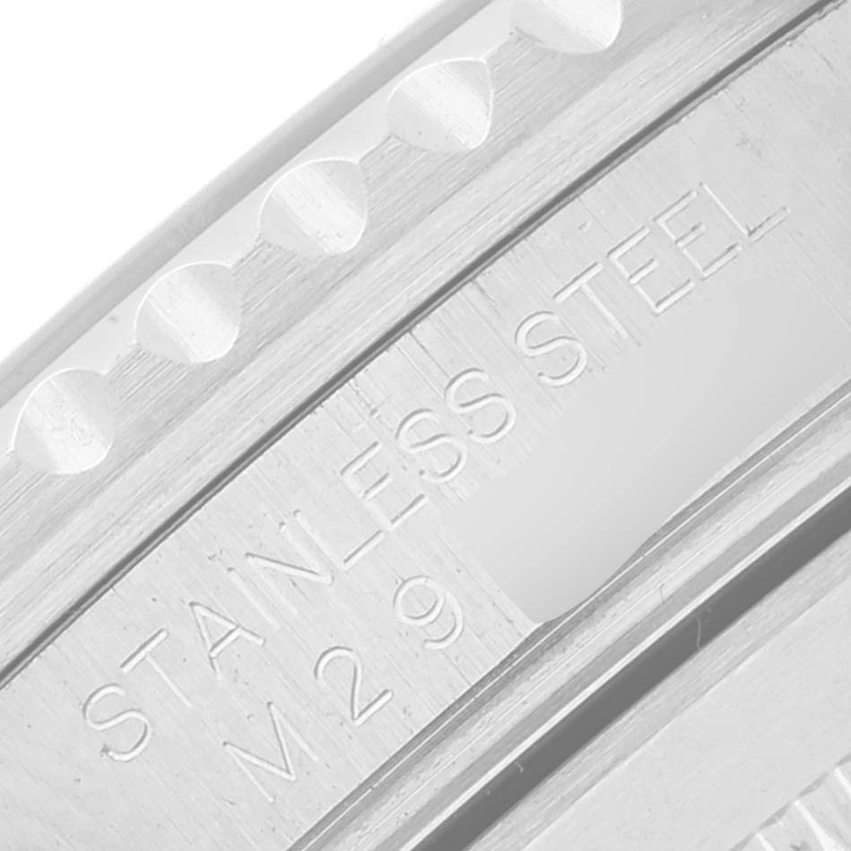 This image shows a close-up of the case side of a Rolex Submariner 16610LV Men's Stainless Steel Black Dial 16610LV Men's Stainless Steel Black Dial, highlighting the engraved "STAINLESS STEEL" marking.