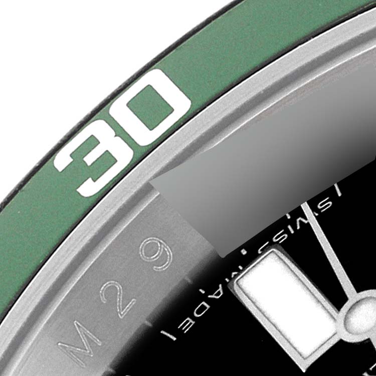 This image shows a close-up of the bezel and a part of the dial of a Rolex Submariner 16610LV Men's Stainless Steel Black Dial 16610LV Men's Stainless Steel Black Dial watch.