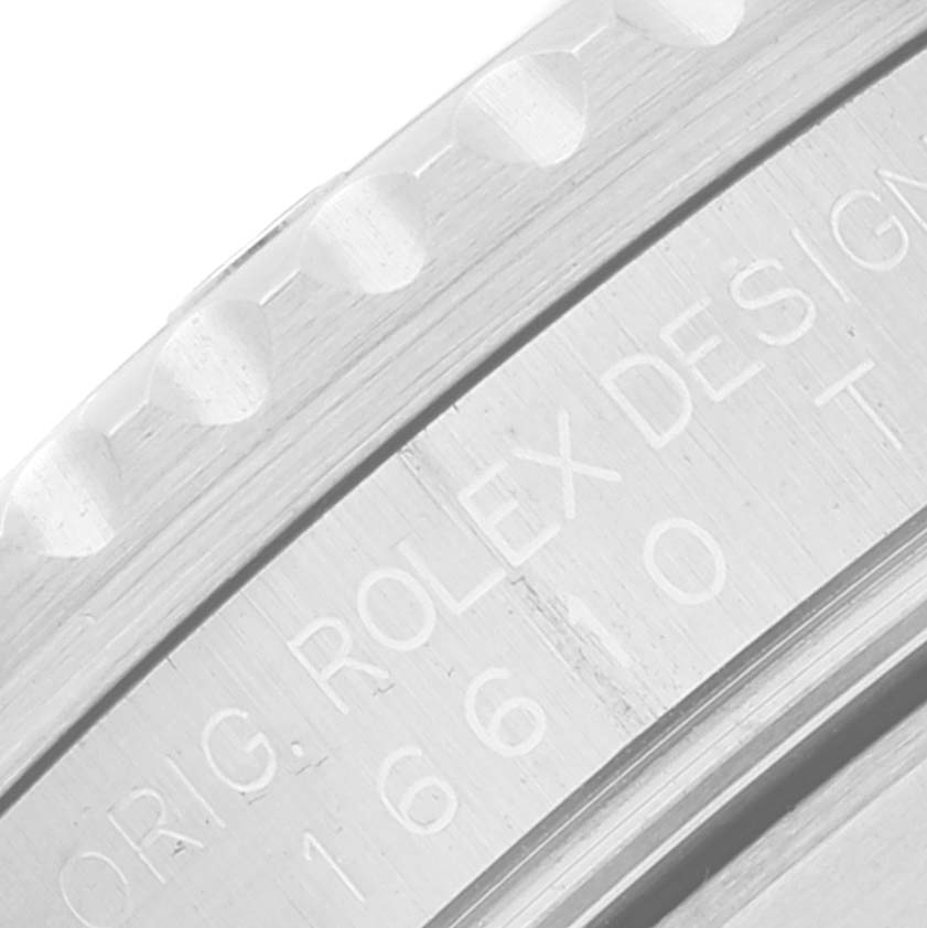 The image shows a close-up view of the bezel and engraved text on the case of a Rolex Submariner 16610LV Men's Stainless Steel Black Dial 16610LV Men's Stainless Steel Black Dial.