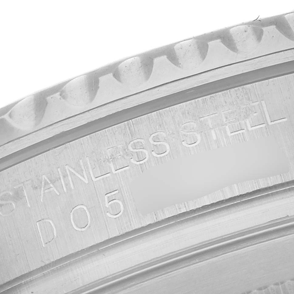 This close-up image shows the side engraving and partially the bezel of a Rolex Yacht-Master 16622 Men's Stainless Steel Silver Dial 16622 Men's Stainless Steel Silver Dial watch.