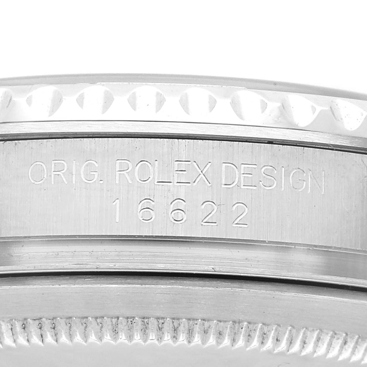 This is a close-up of the case side of a Rolex Yacht-Master 16622 Men
s Stainless Steel Silver Dial 16622 Men
s Stainless Steel Silver Dial, showcasing "ORIG. ROLEX DESIGN 16622" engraving.
