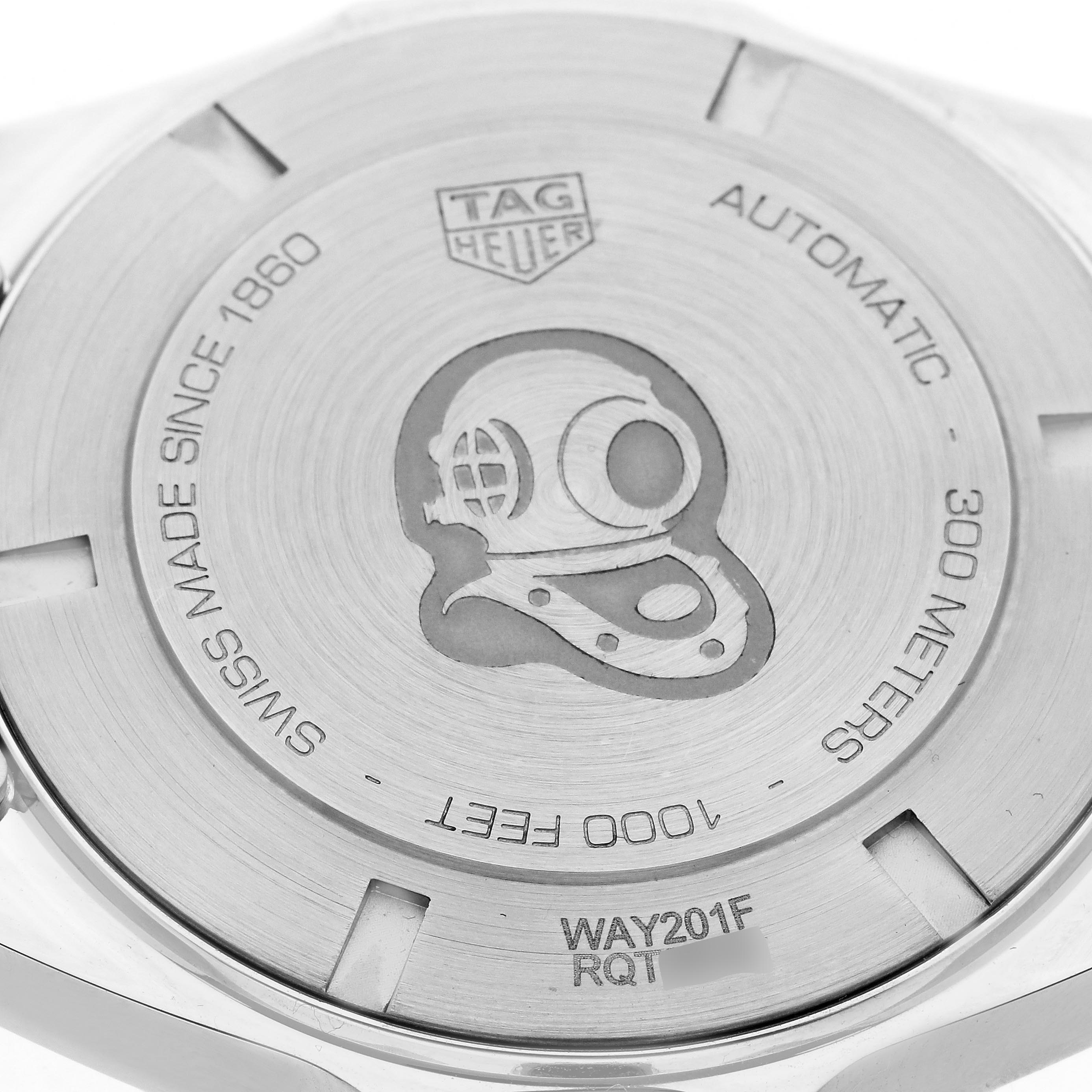 The image shows the case back of a Tag Heuer Aquaracer WAY201F.BA0927 Men
s Stainless Steel Black Dial WAY201F.BA0927 Men
s Stainless Steel Black Dial watch, featuring a diving helmet engraving and water resistance specifications.