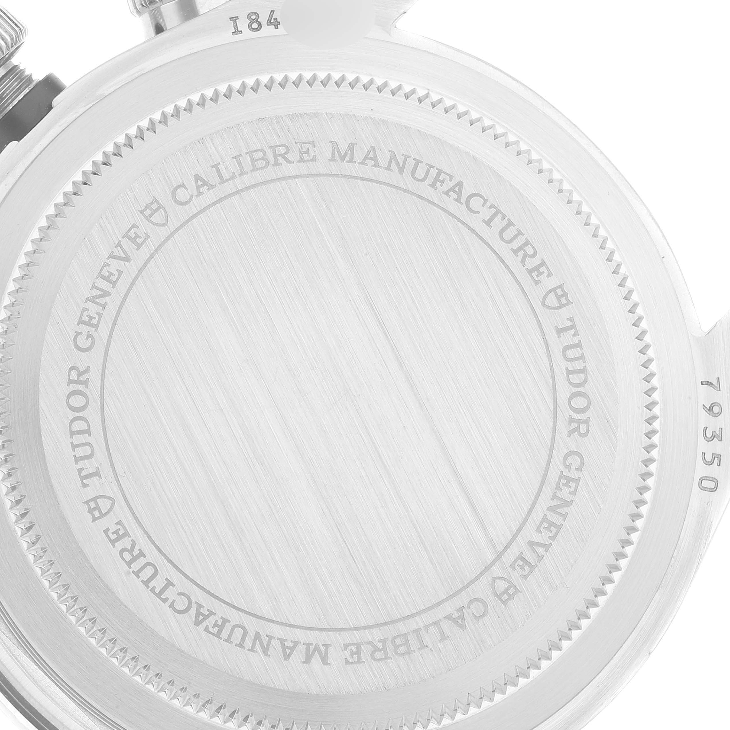 The image shows the case back of the Tudor Heritage Chrono 79350 Men's Stainless Steel Black Dial 79350 Men's Stainless Steel Black Dial watch, including the engraved details and serial number.