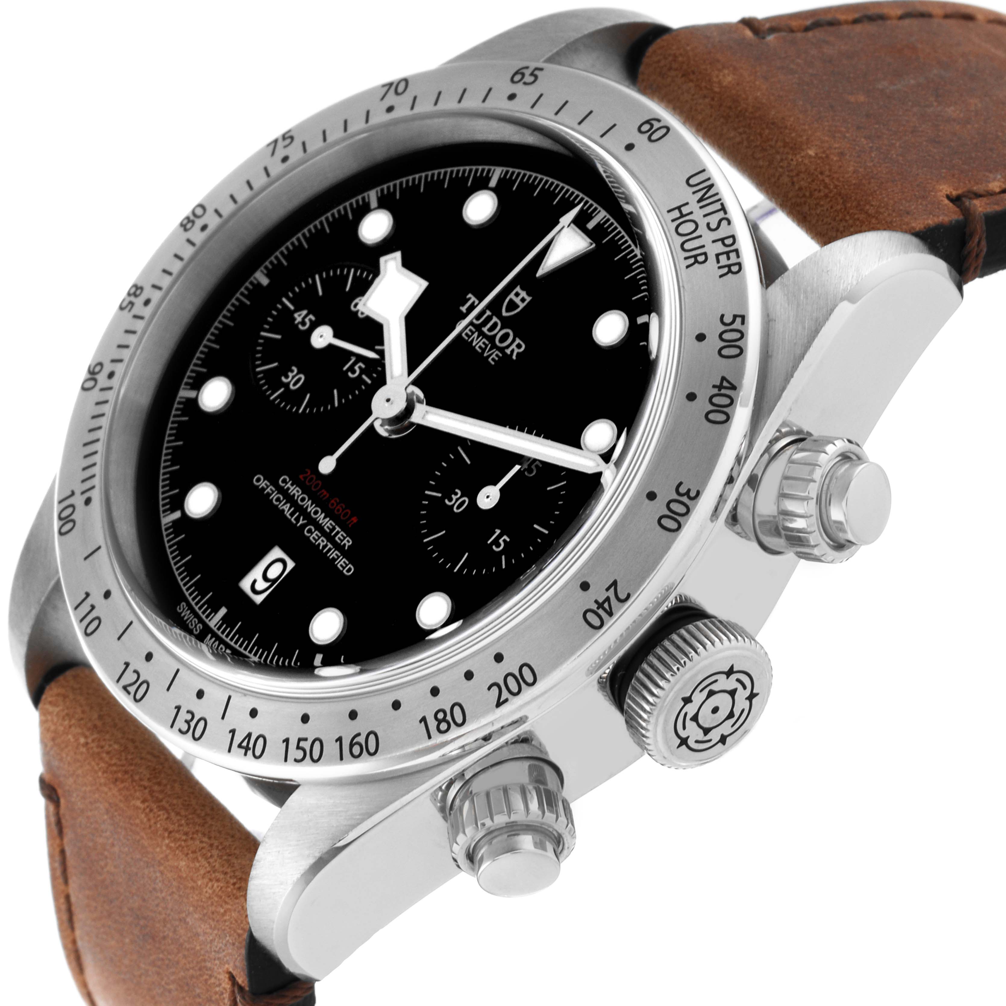 The Tudor Heritage Chrono 79350 Men's Stainless Steel Black Dial 79350 Men's Stainless Steel Black Dial watch is shown at an angled side view, highlighting its bezel, dial, crown, pushers, and leather strap.