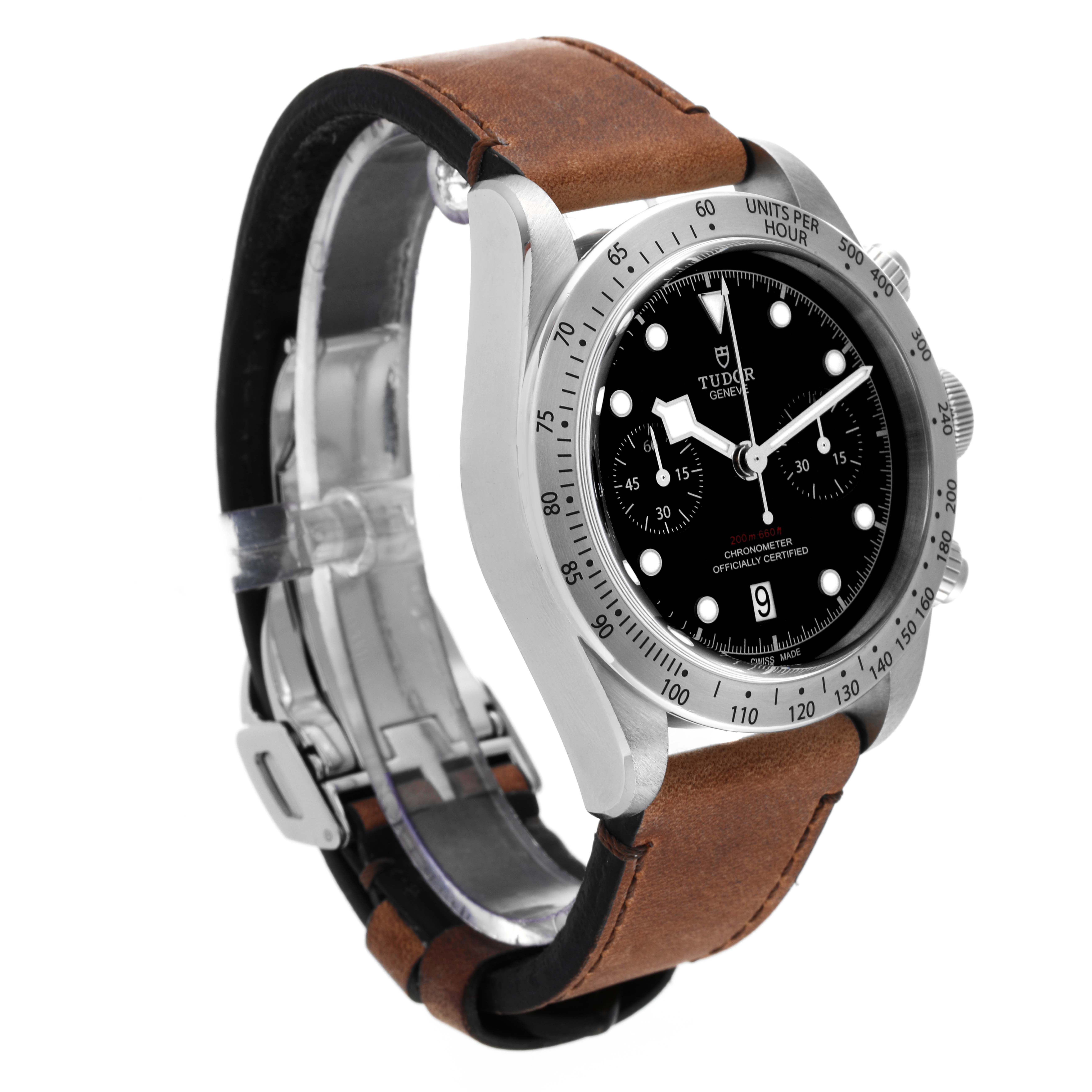The Tudor Heritage Chrono 79350 Men's Stainless Steel Black Dial 79350 Men's Stainless Steel Black Dial watch is shown at a slight angle, displaying its bezel, dial, crown, and brown leather strap.
