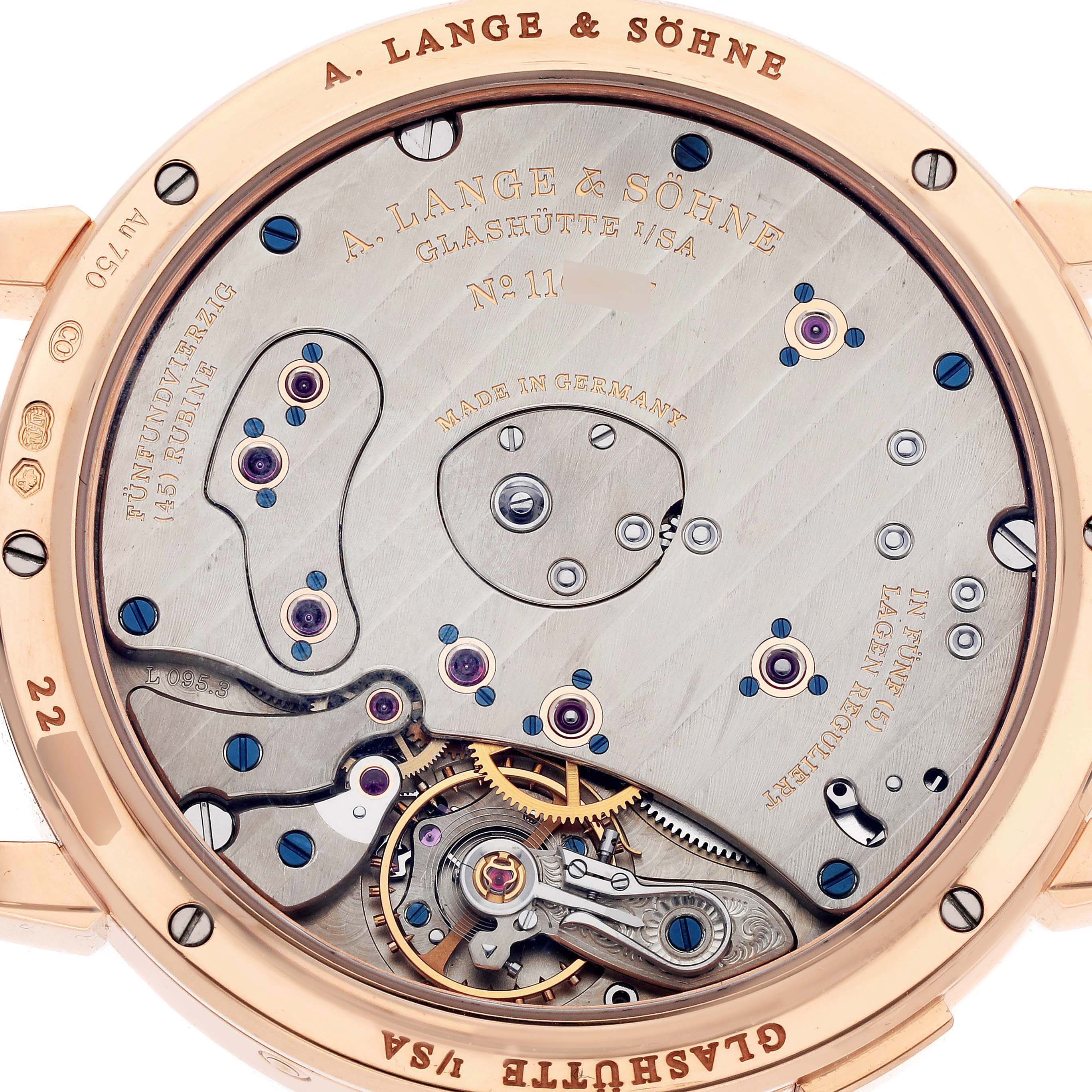 The image shows the movement of the A. Lange & Sohne Lange 1 139.032 Men's Rose Gold Silver Dial watch from the back, highlighting gears and intricate mechanisms.