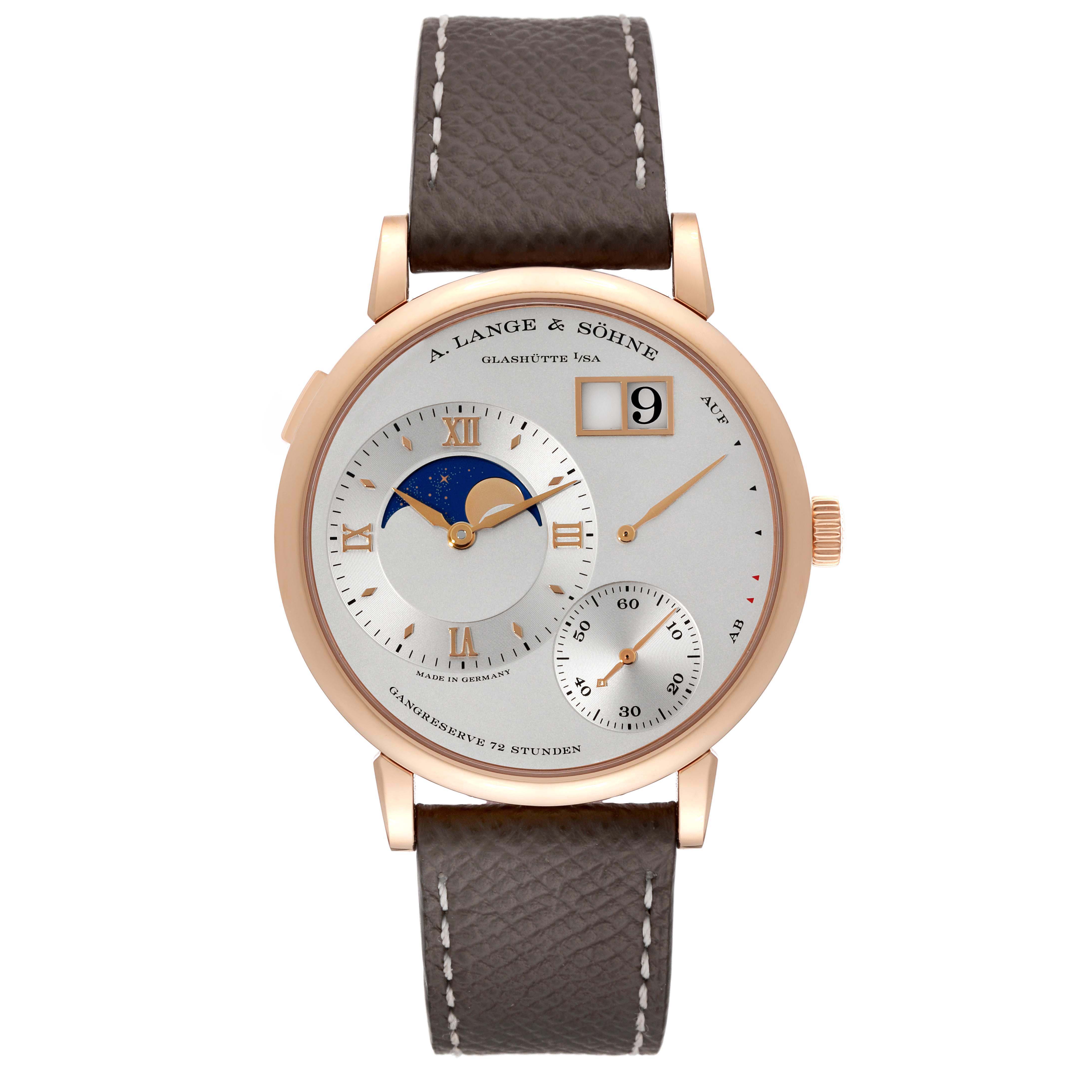 The Lange 1 by A. Lange & Söhne is shown from a front angle, displaying the face, strap, and crown.